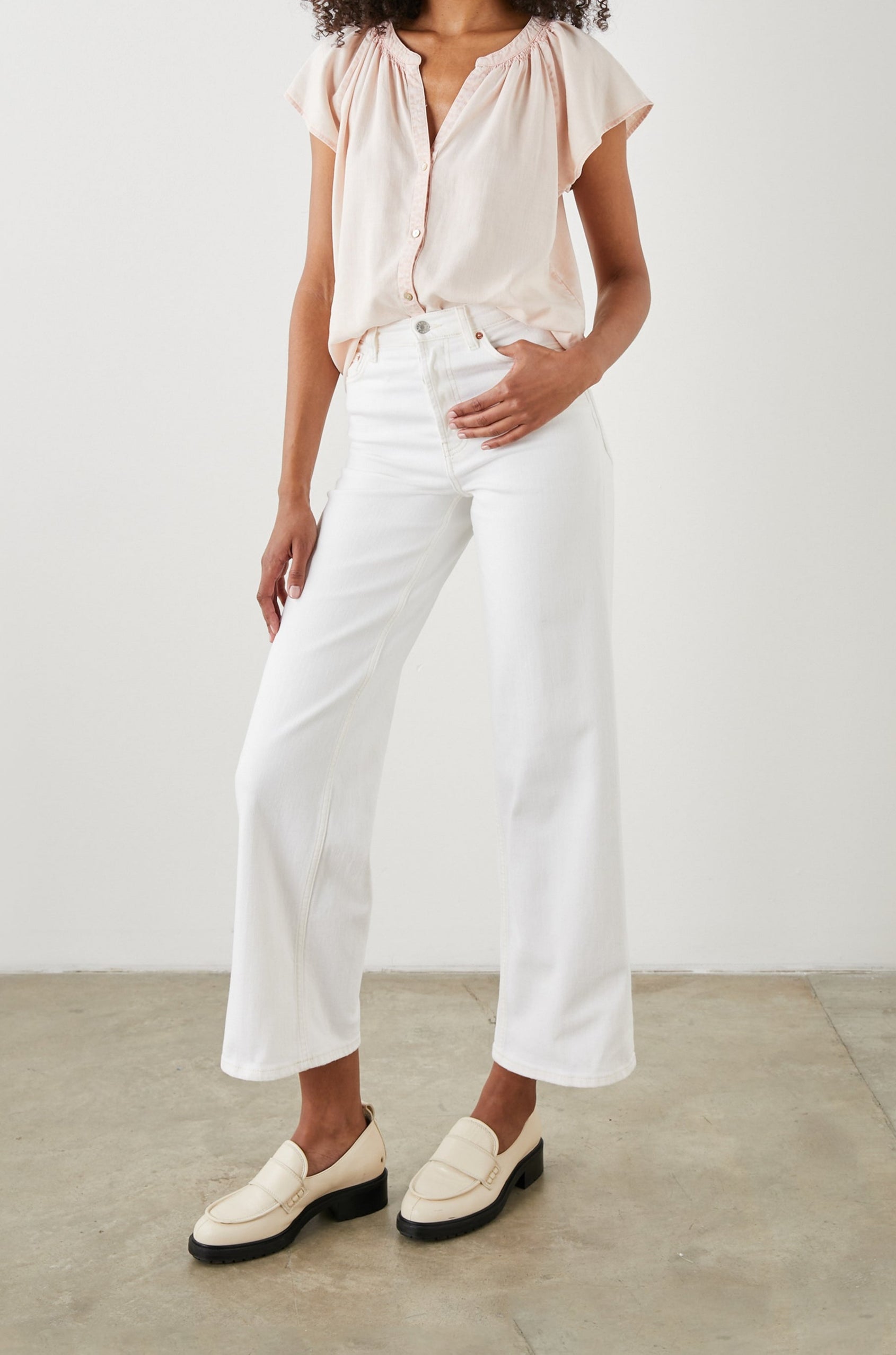 Alena Short Sleeve Top with Flutter Sleeves, a V Neck, Buttons Down the Bodice and Ruching along the Collar in Petal Colorway - Front Full Body View Featured on Model