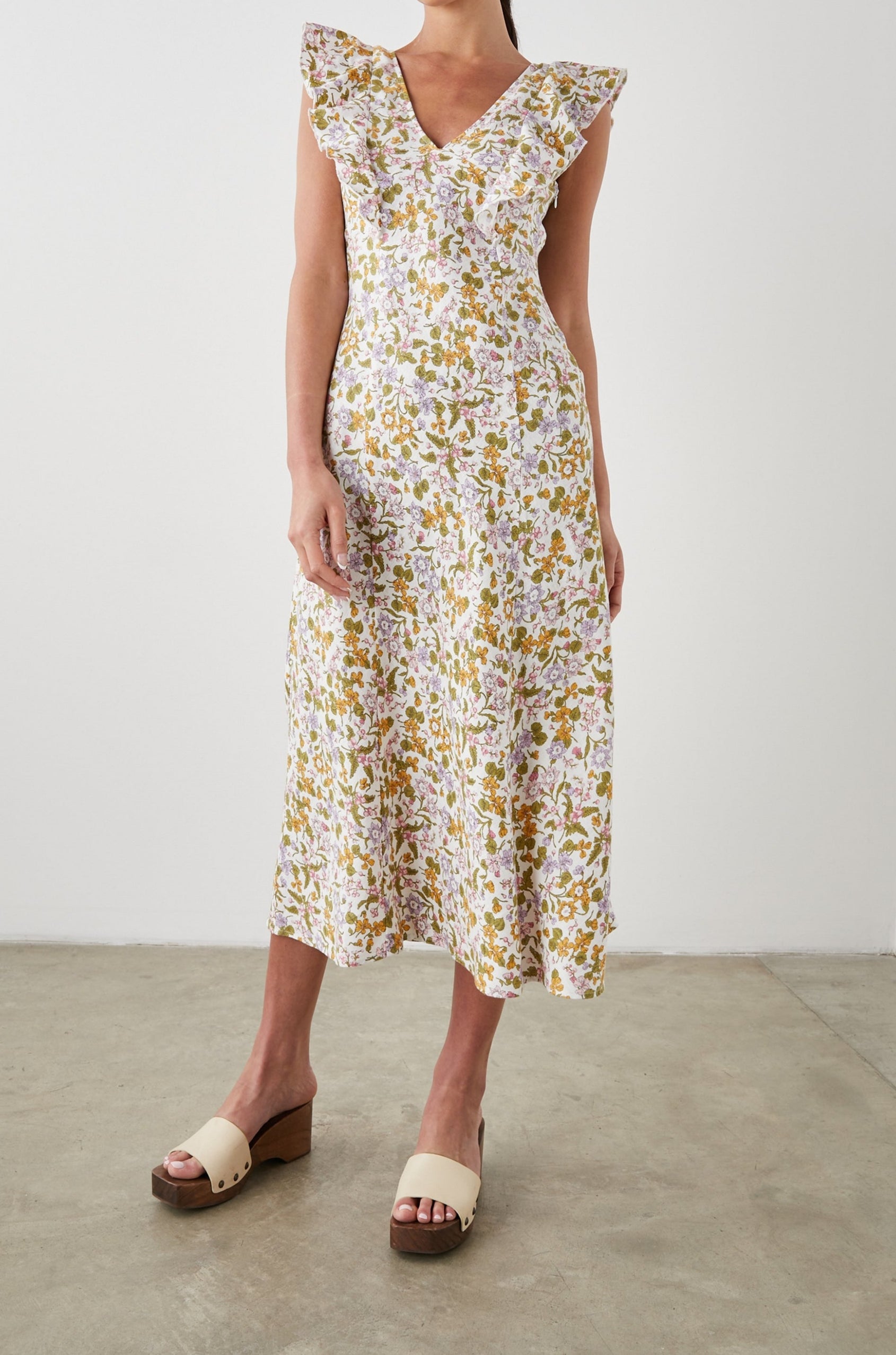 Constance Short Sleeve Midi Dress with Flutter Sleeves, a V Neck, and Cross Ties Across the Mid to Upper Back in Tansy Colorway, Brown, Orange, Purple, Pink and Green on White - Front Full Body View Featured on Model