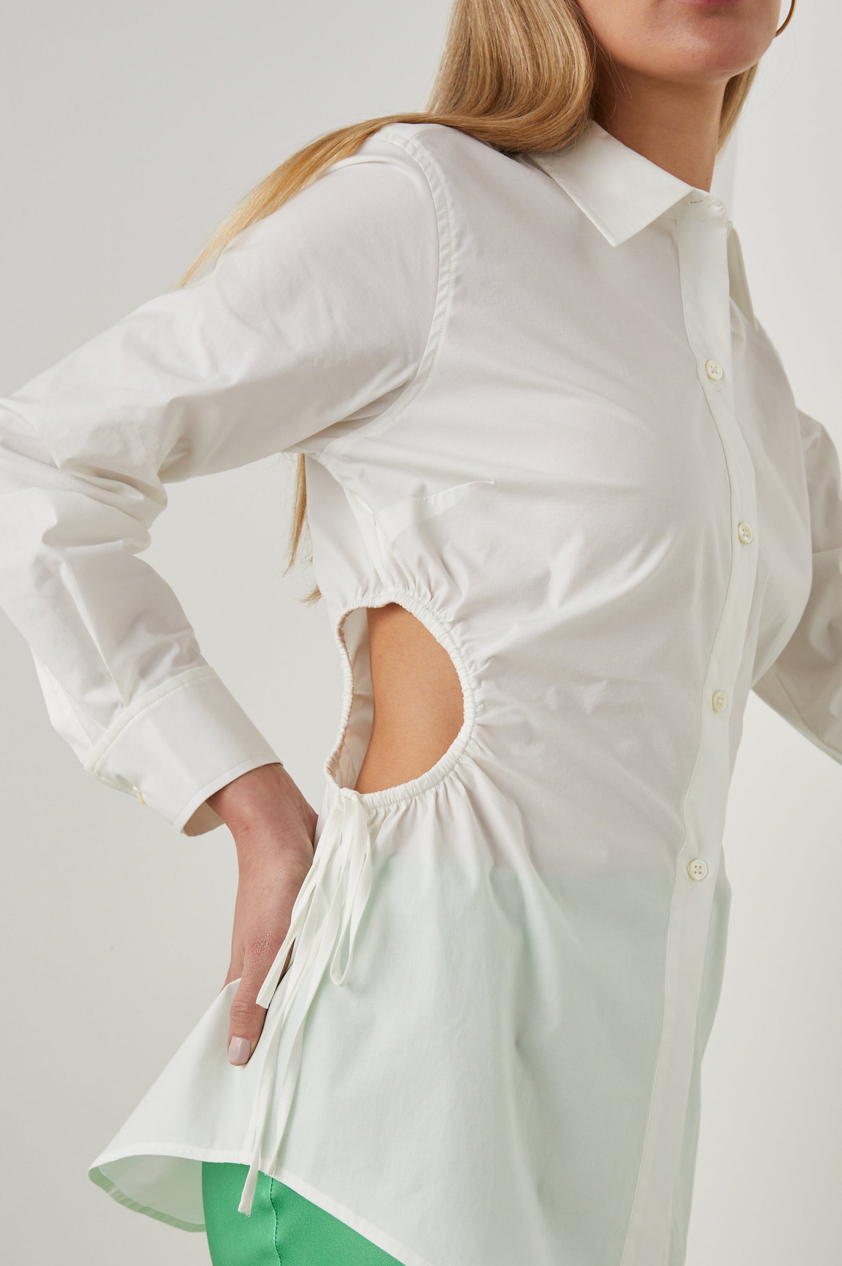 Cristiana Long-Sleeve Button Down with an Oval Cutout with a Drawstring on Each Side in White Colorway - Side View Featured on Model