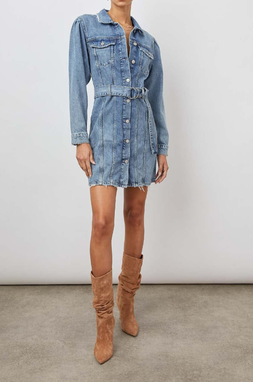 Griffith Long-Sleeve Denim Mini Dress with Buttons Down the Front, a Fabric Double Ring Belt, Two Chest Button Flap Pockets, Frayed Trim and Vertical Seams Down the Front in Indigo Charm Colorway - Front Full Body View Featured on Model
