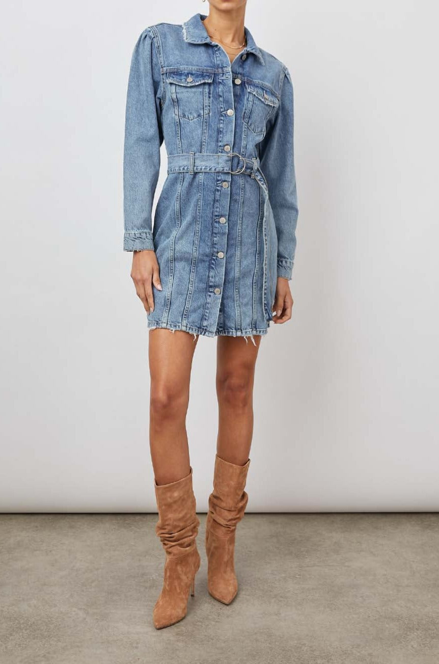Griffith Long-Sleeve Denim Mini Dress with Buttons Down the Front, a Fabric Double Ring Belt, Two Chest Button Flap Pockets, Frayed Trim and Vertical Seams Down the Front in Indigo Charm Colorway - Front Full Body View Featured on Model