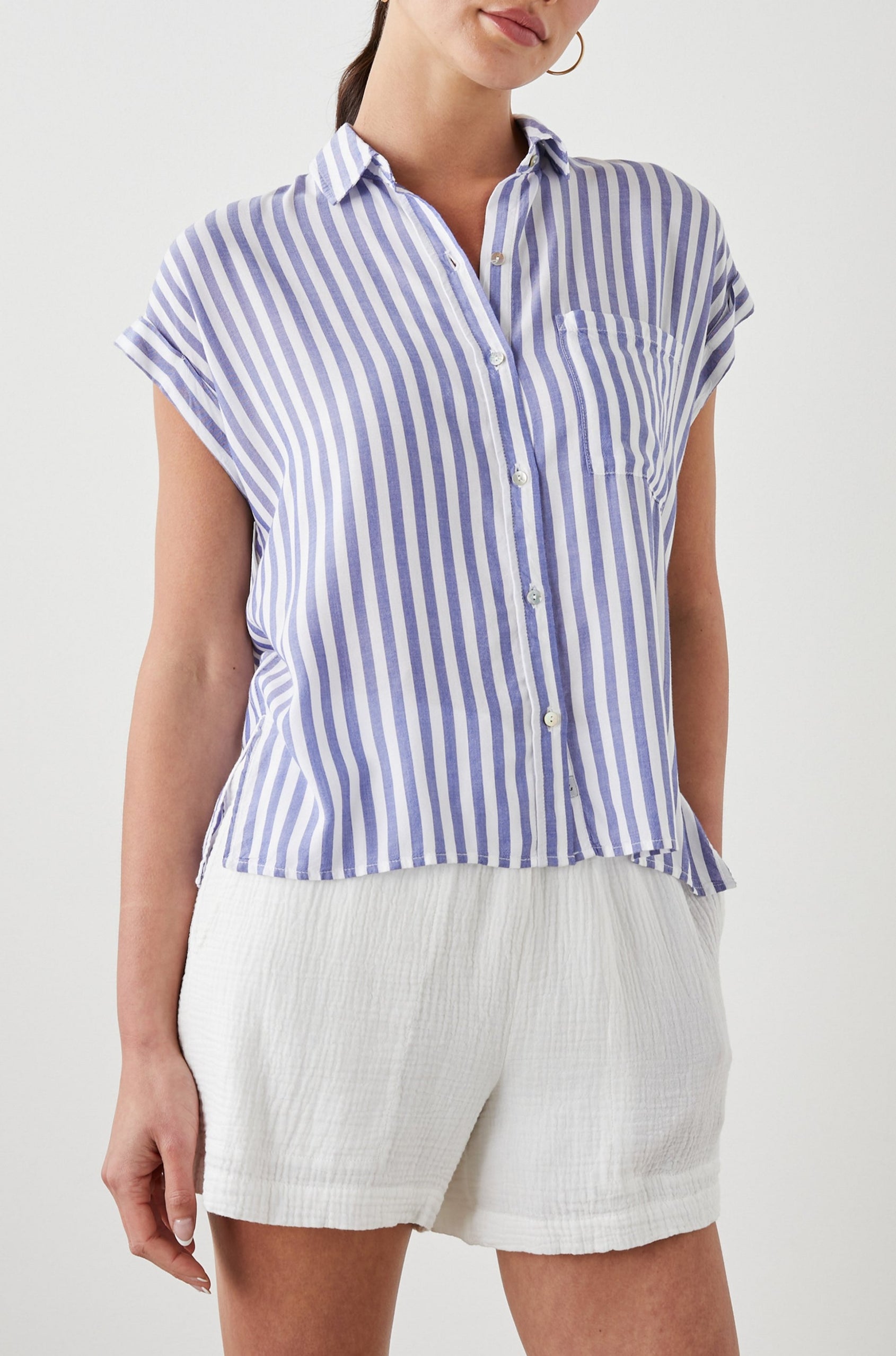 Whitney Short Rolled Sleeves Button Up with a Chest Patch Pocket and Short Side Slits in Blue White Stripe Colorway, with vertical stripes - Front View Featured on Model