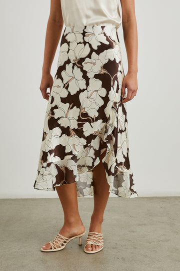 Adia Double Layer Midi Skirt in Mocha Floral Colorway, Cream Flowers on Mocha - Front View Featured on Model 