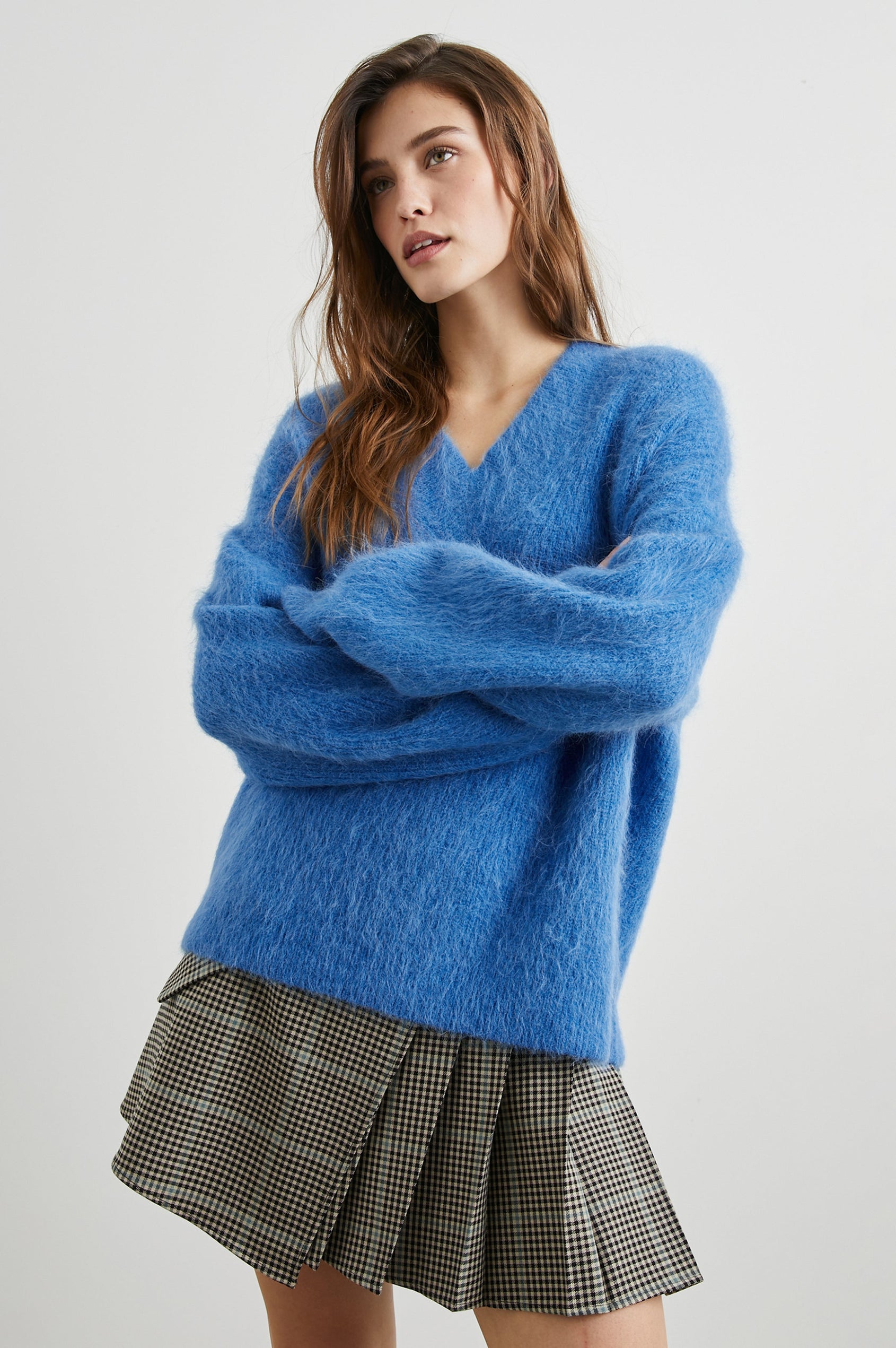 Adriana Mini Wrap Skirt with a Button, Front Flap Pocket and Pleats on Half the Skirt in Teal Multi Check Colorway, a plaid in Teal, Black and Tan - Front View Featured on Model 