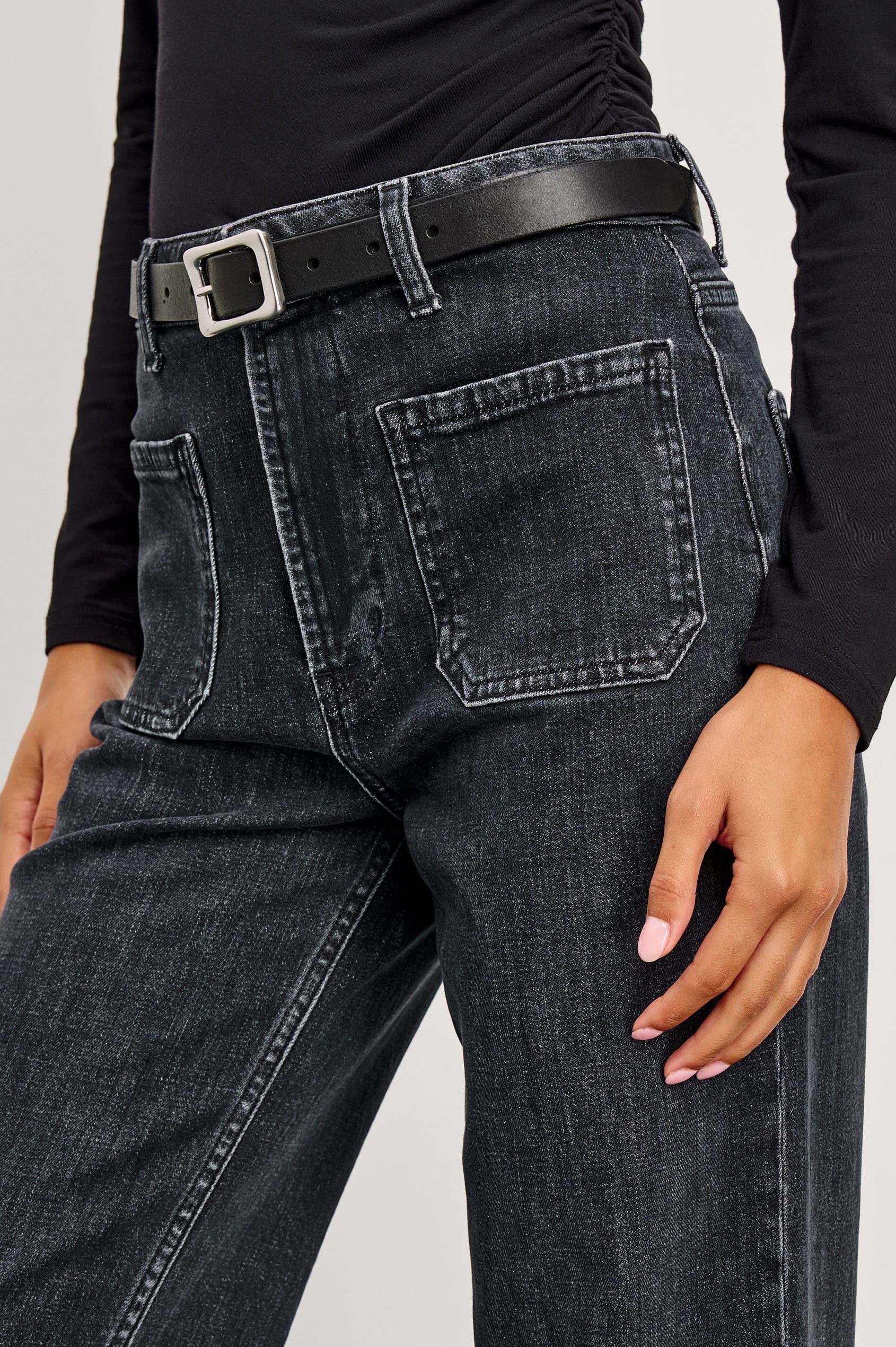 Alamitos high waisted denim trouser with flared leg and front patch pockets in Black Pearl colorway- front detail view on model