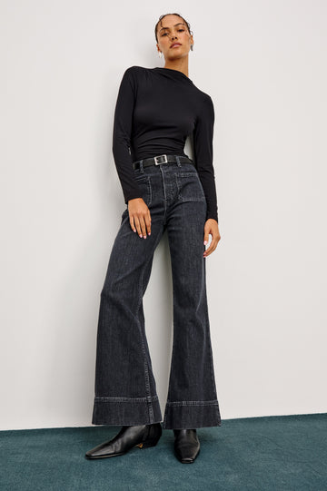 Alamitos high waisted denim trouser with flared leg and front patch pockets in Black Pearl colorway- front full body view on model