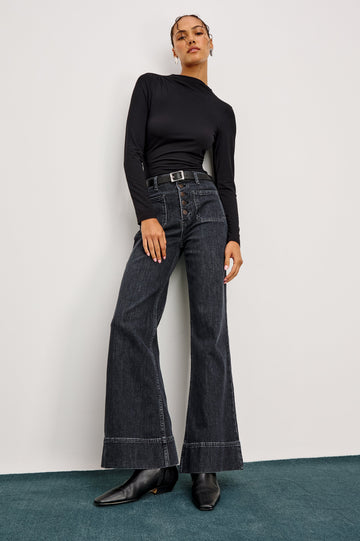 Alamitos high waisted denim trouser with flared leg and front patch pockets in Black Pearl colorway- front full body view on model