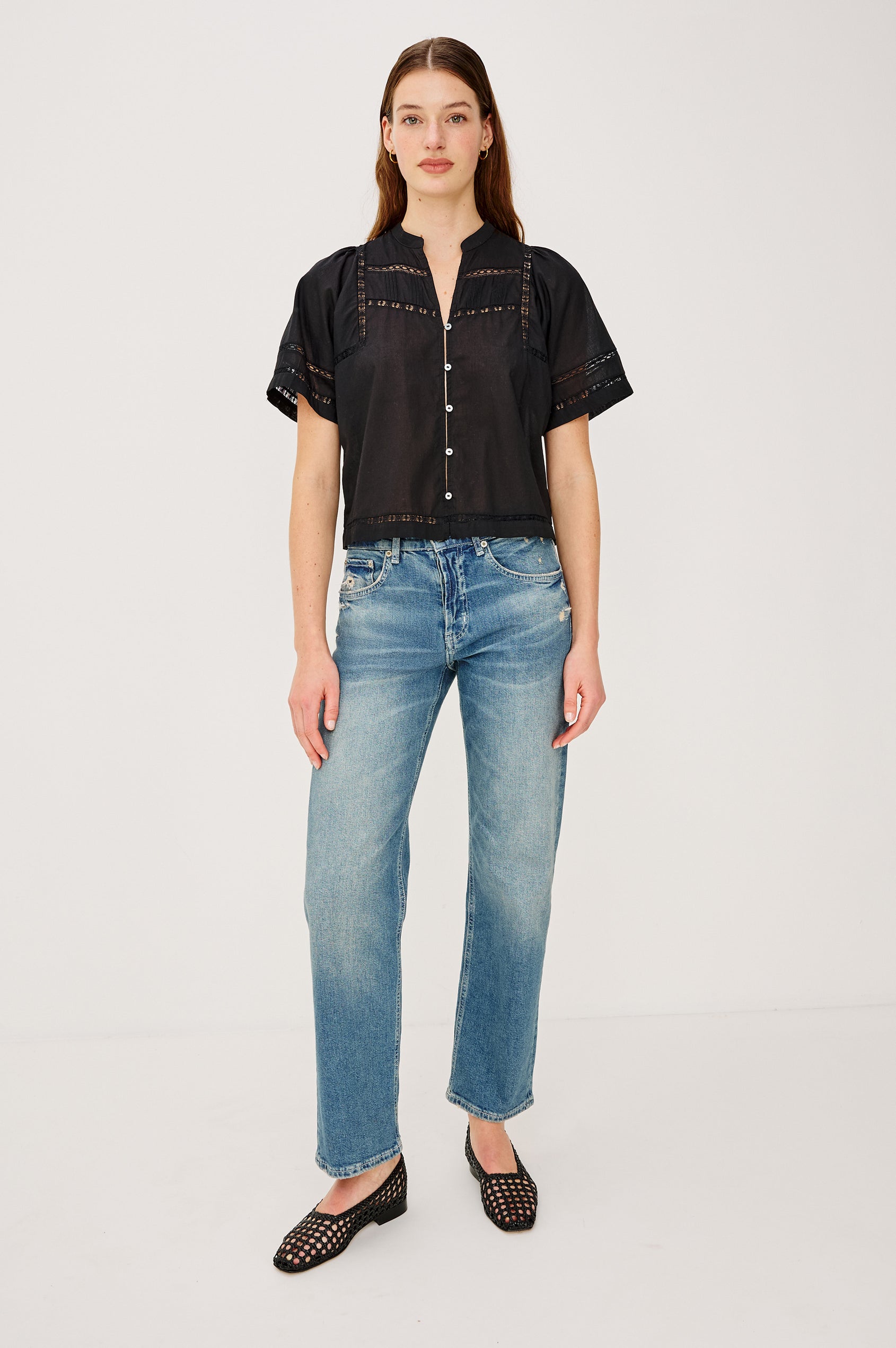 Alanis Shirt in Lightweight Cotton With Split Band V-Neckline, Front Button-and-Loop Closures, Lattice Embroidery, and Short Puff Sleeves in Black Colorway - Upper Body Back View Featured on Model