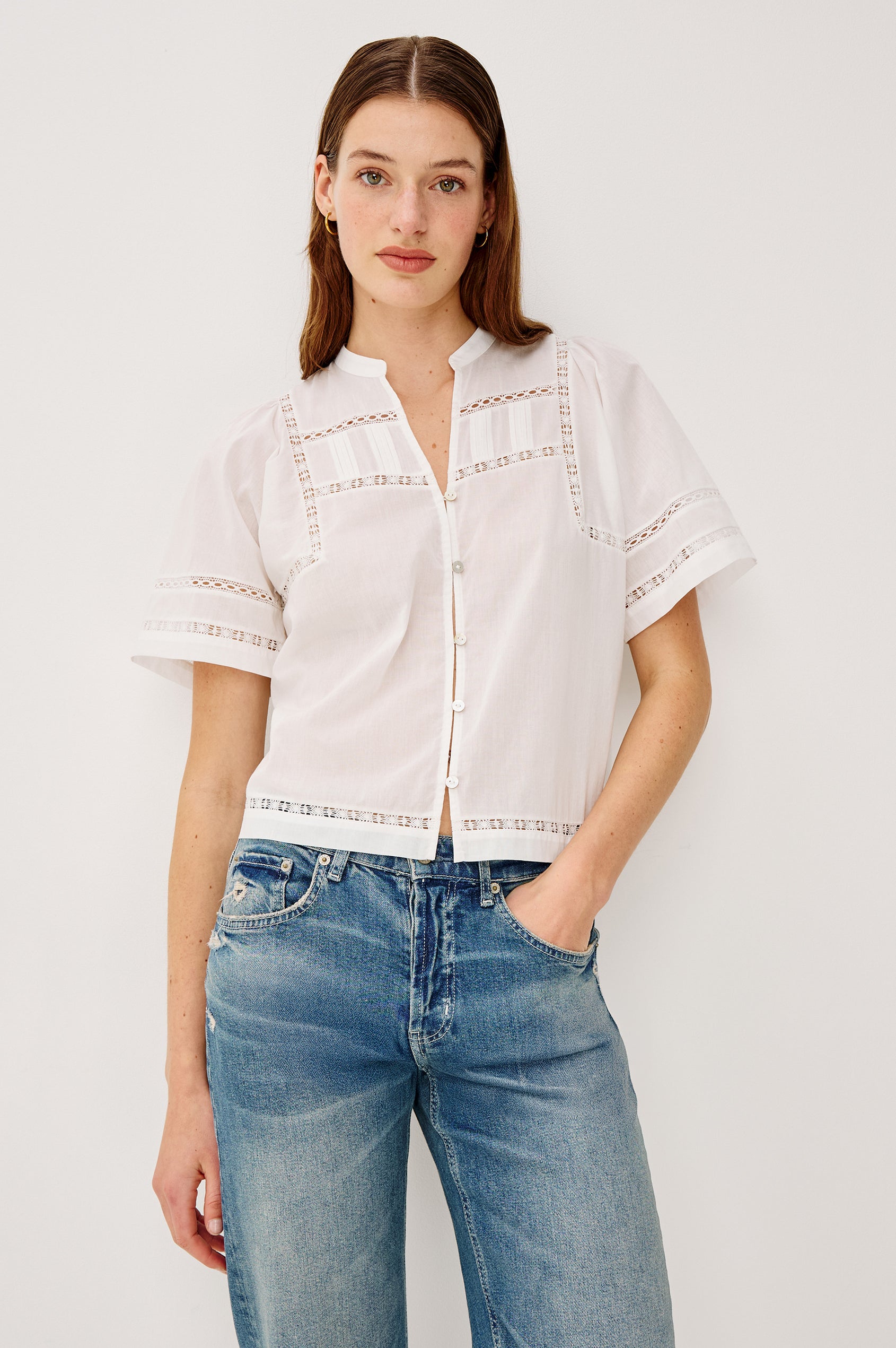 Alanis Shirt in Lightweight Cotton With Split Band V-Neckline, Front Button-and-Loop Closures, Lattice Embroidery, and Short Puff Sleeves in White Colorway - Upper Body Front View Featured on Model