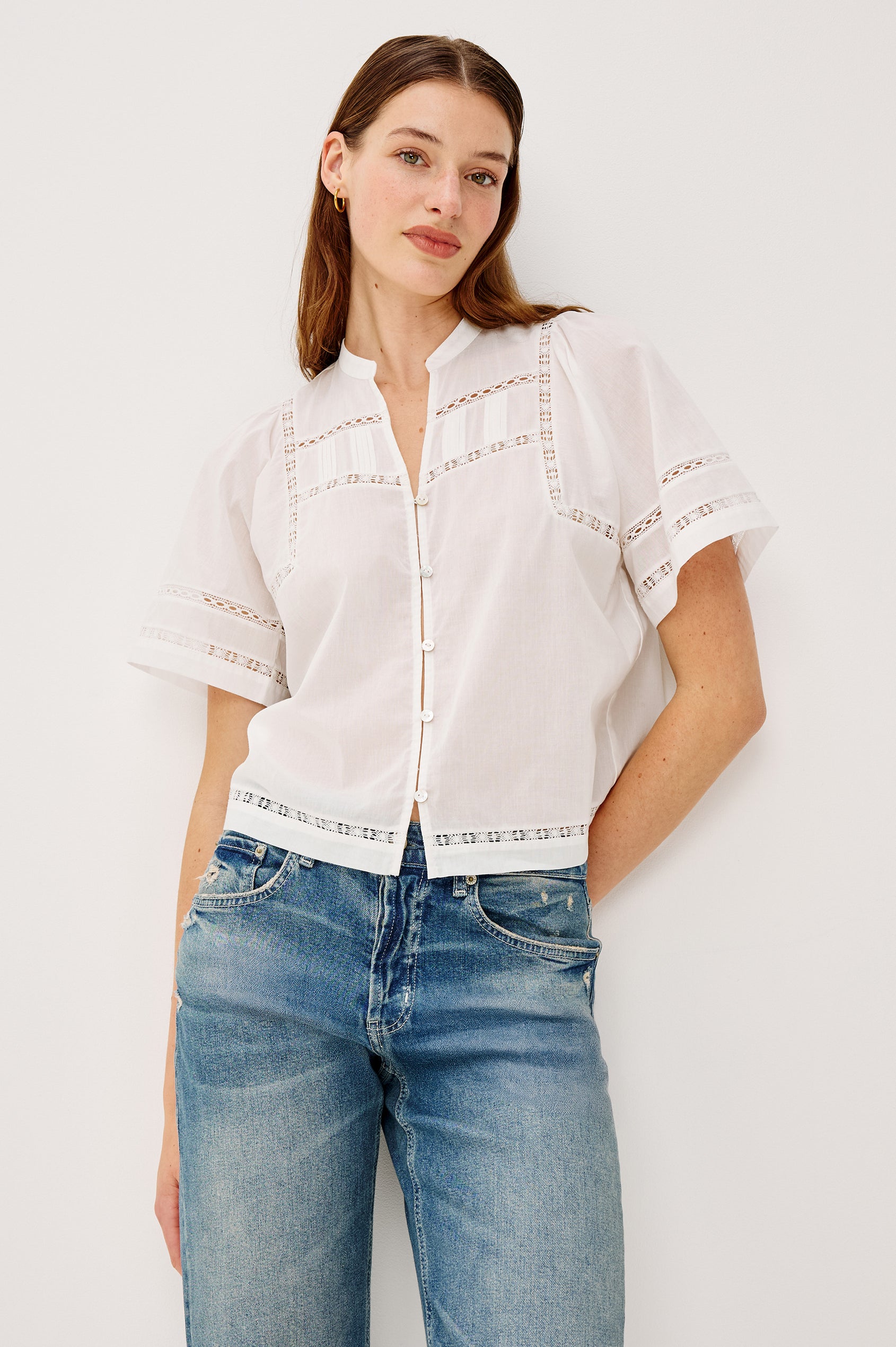 Alanis Shirt in Lightweight Cotton With Split Band V-Neckline, Front Button-and-Loop Closures, Lattice Embroidery, and Short Puff Sleeves in White Colorway - Upper Body Front View Featured on Model