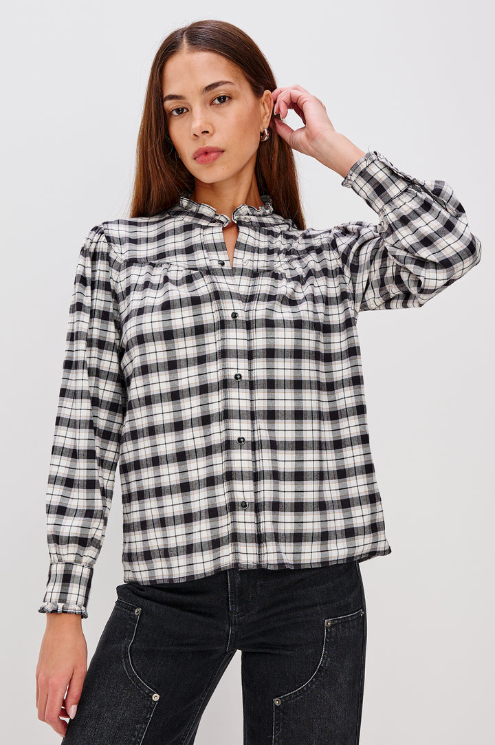 Alanna Long Sleeve Shirt with Snaps Down the Front, a Ruffled Collar, Banded Ruffed Cuffs, and Pleats at the Yoke Seam in Ivory Smoke Onyx Colorway - Front Untucked View Featured on Model