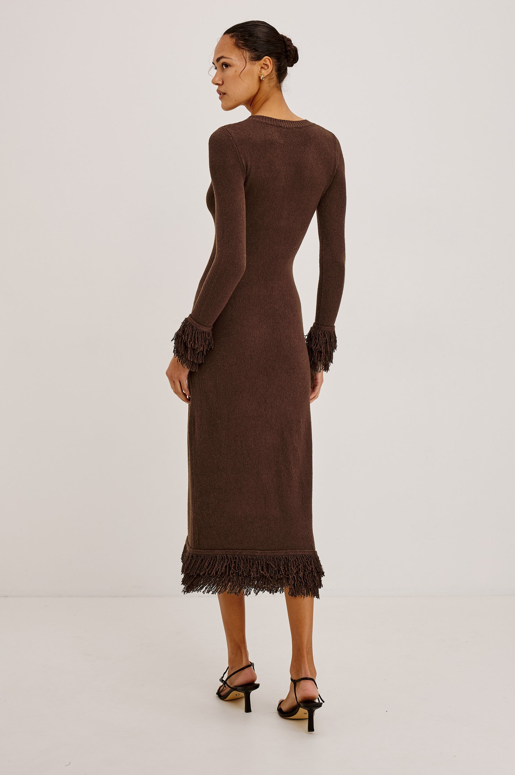 Alejandra Midi Dress in Silk Blend Knit With Fitted Body, Crew Neck, Long Sleeves, and Fringe Trim at the Cuffs and Straight Hem in Espresso Colorway - Full Body Back View Featured on Model