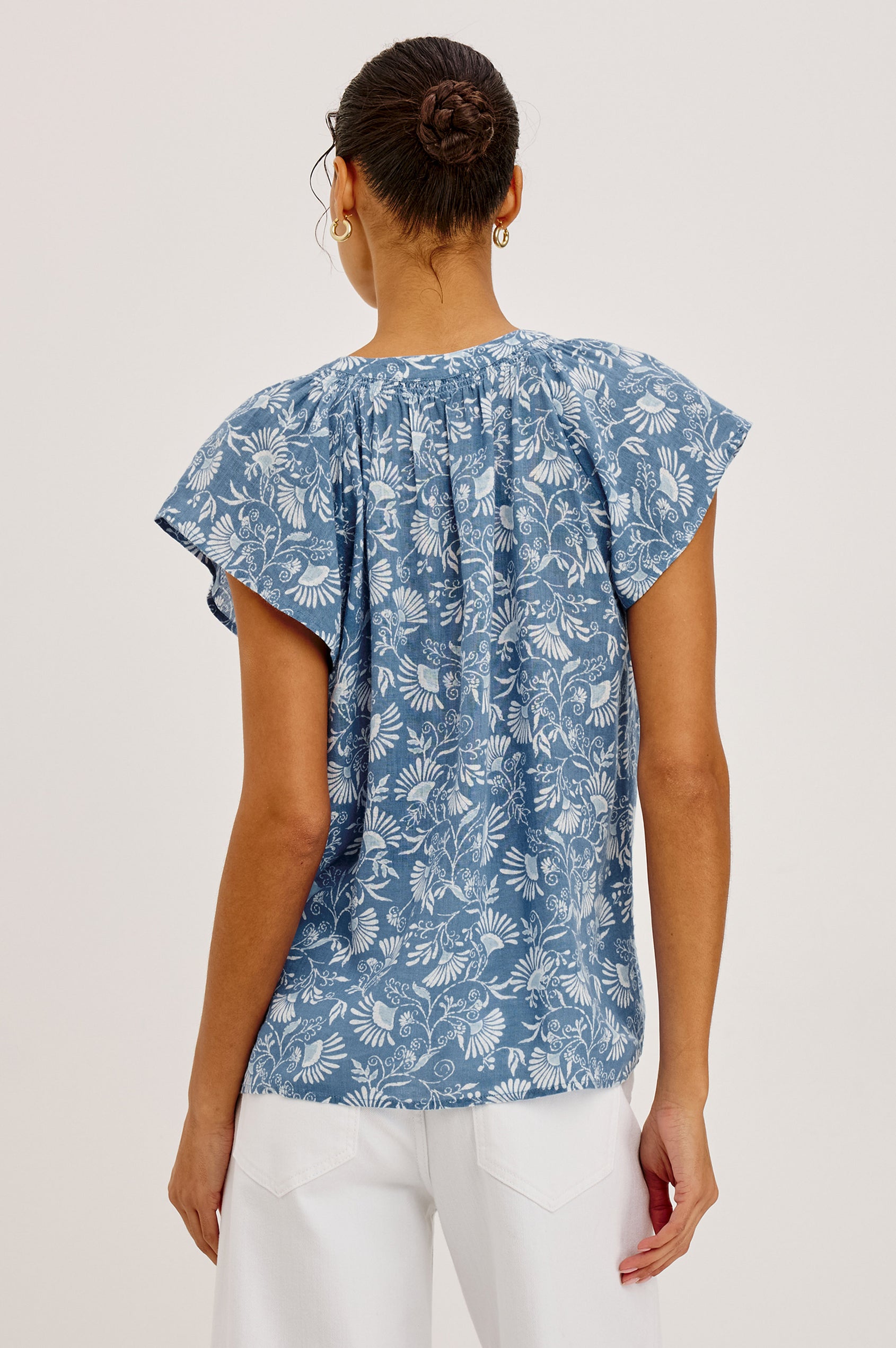 Alena Top in Cotton Gauze With Relaxed Fit, Smocked Split Neckline, Cap Sleeves, and Front Button Placket in Blue Cassia Colorway - Upper Body Back View Featured on Model
