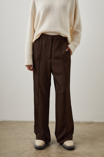 Alta Pants with a Front and Back Center Vertical Leg Pleat and Two Front Pockets in Espresso Colorway - Front View Featured on Model  