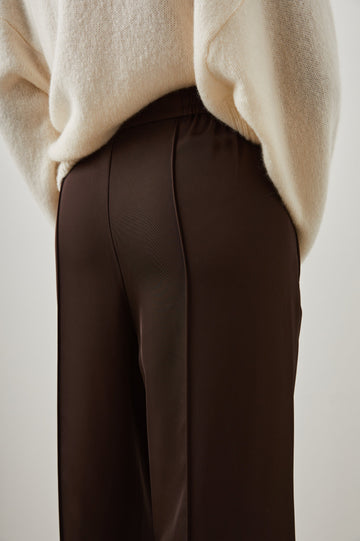 Alta Pants with a Front and Back Center Vertical Leg Pleat and Two Front Pockets in Espresso Colorway - Back View Featured on Model  