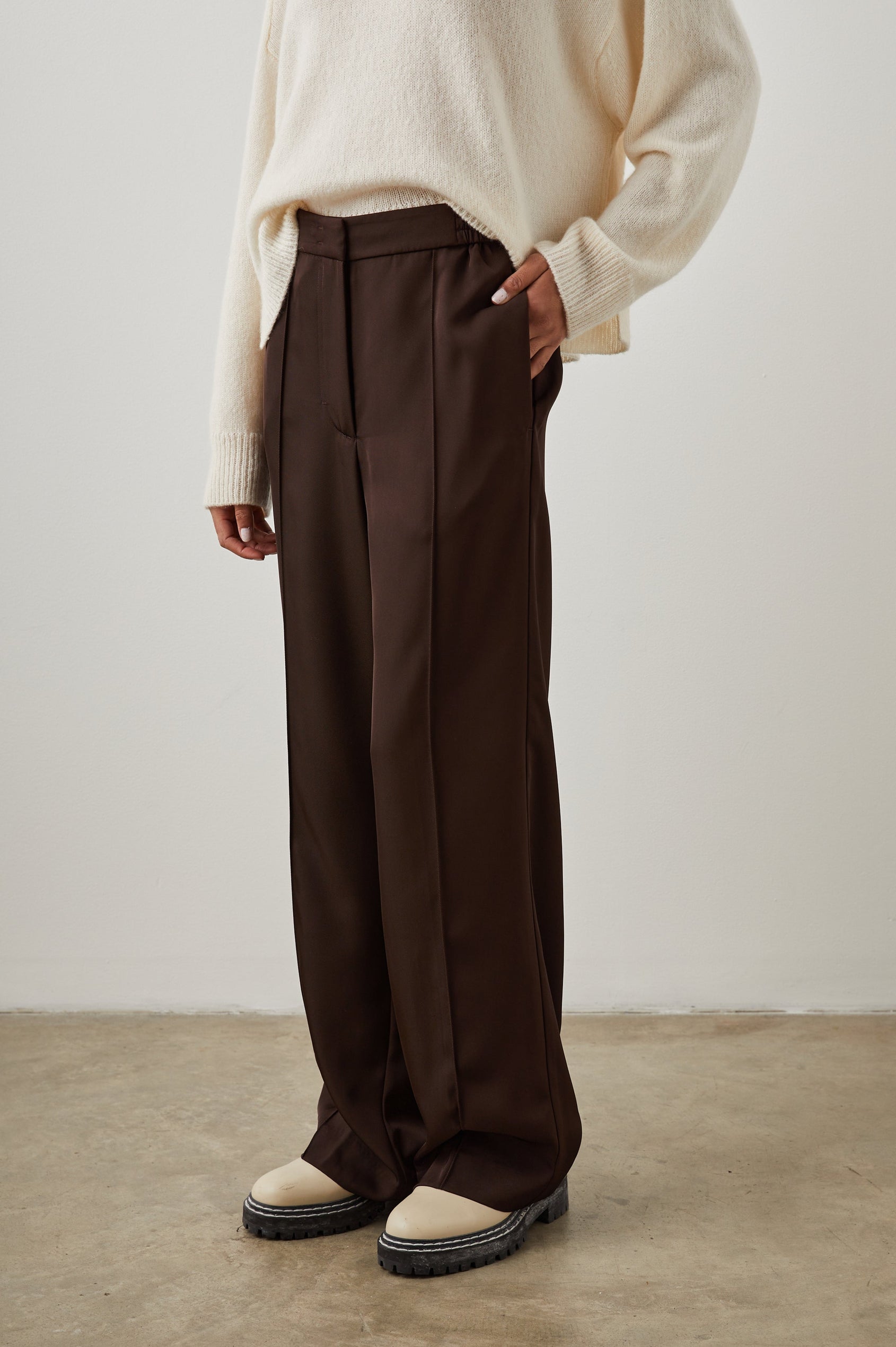 Alta Pants with a Front and Back Center Vertical Leg Pleat and Two Front Pockets in Espresso Colorway - Front View Featured on Model  