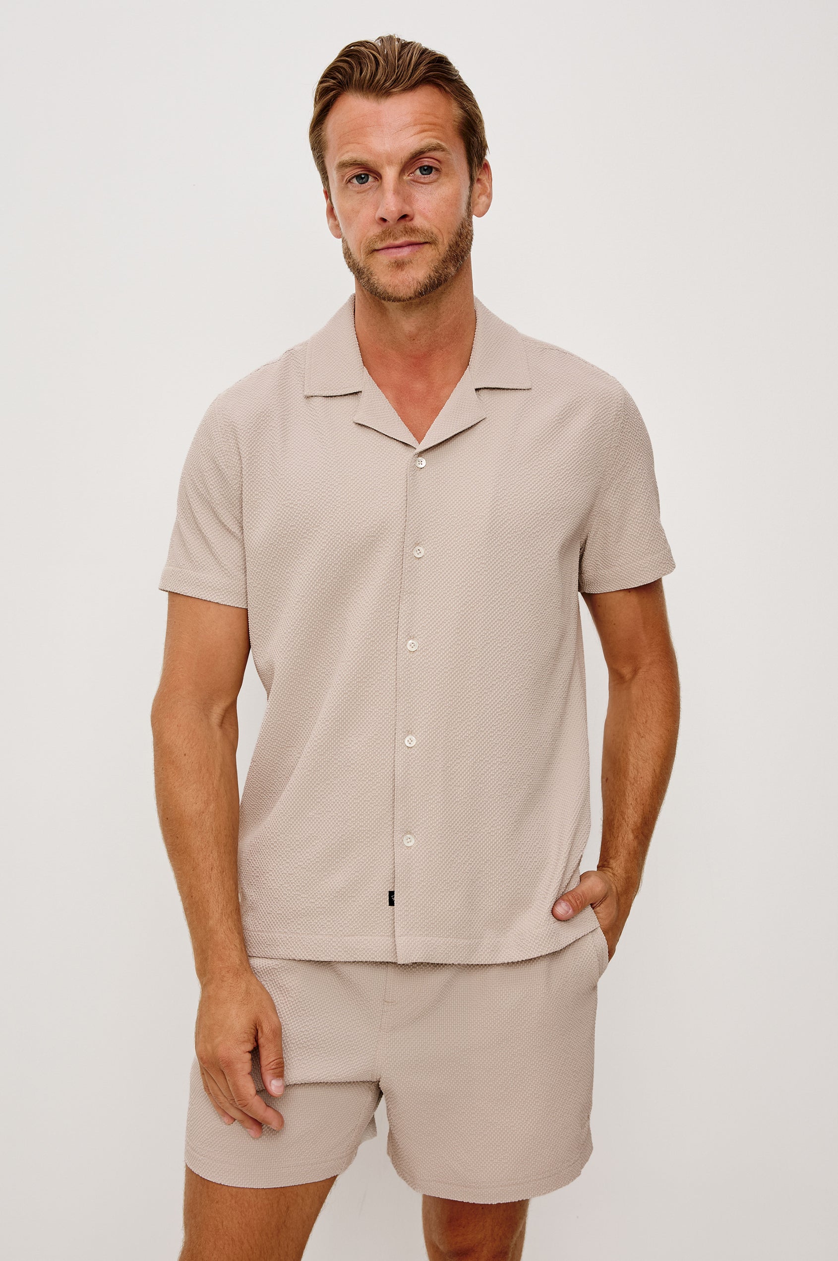 La Brea Swim Short in Stretch Polyester Seersucker With Adjustable Drawstring Waist Ties in Khaki Check Seersucker Colorway - Upper Body Front View Featured on Model