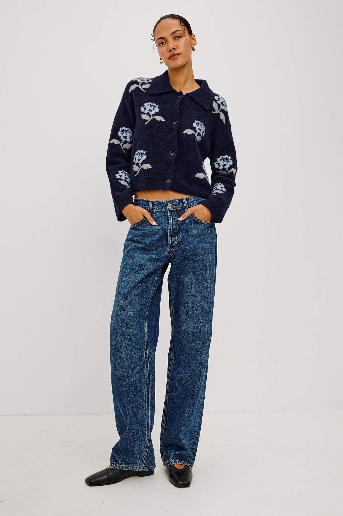 Amber Cardigan in Floral Jacquard Knit With Front Buttons, Point Collar, and Long Sleeves in Navy Petals Colorway - Full Body Front View Featured on Model.