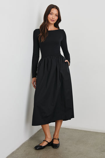 Amberly Long-Sleeve Midi Dress with Boat Neckline in Black Colorway - Front Full Body View Featured on Model