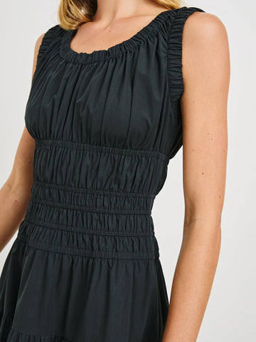Anastasia Sleeveless Tiered Midi Dress with Shoulder Straps, a Scoop Neck and Ruching on the Bodice in Black Colorway - Front View Featured on Model  