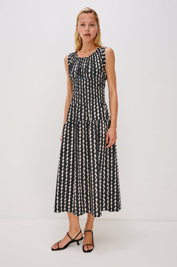 Anastasia Sleeveless Tiered Midi Dress with Shoulder Straps, a Scoop Neck and Ruching on the Bodice in Painted Noir Colorway - full body front view on model