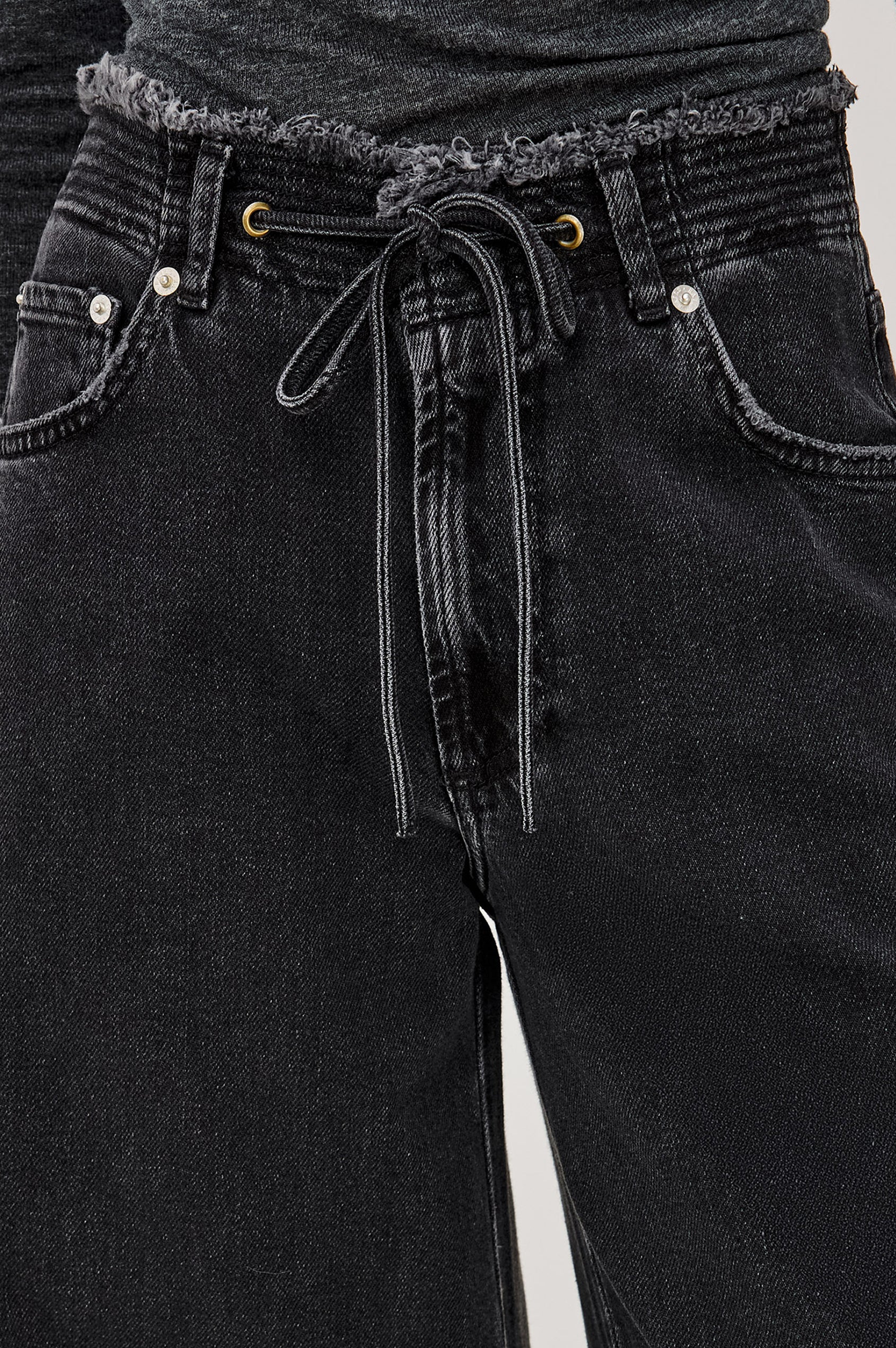 Angeleno Wide Leg in Rigid Denim With Hidden Stretch, Relaxed Mid-Rise Fit, 5-Pockets, Self-Tie Shoelace Belt, and Frayed Waistband in Ash Black Colorway - Lower Body Front View Featured on Model