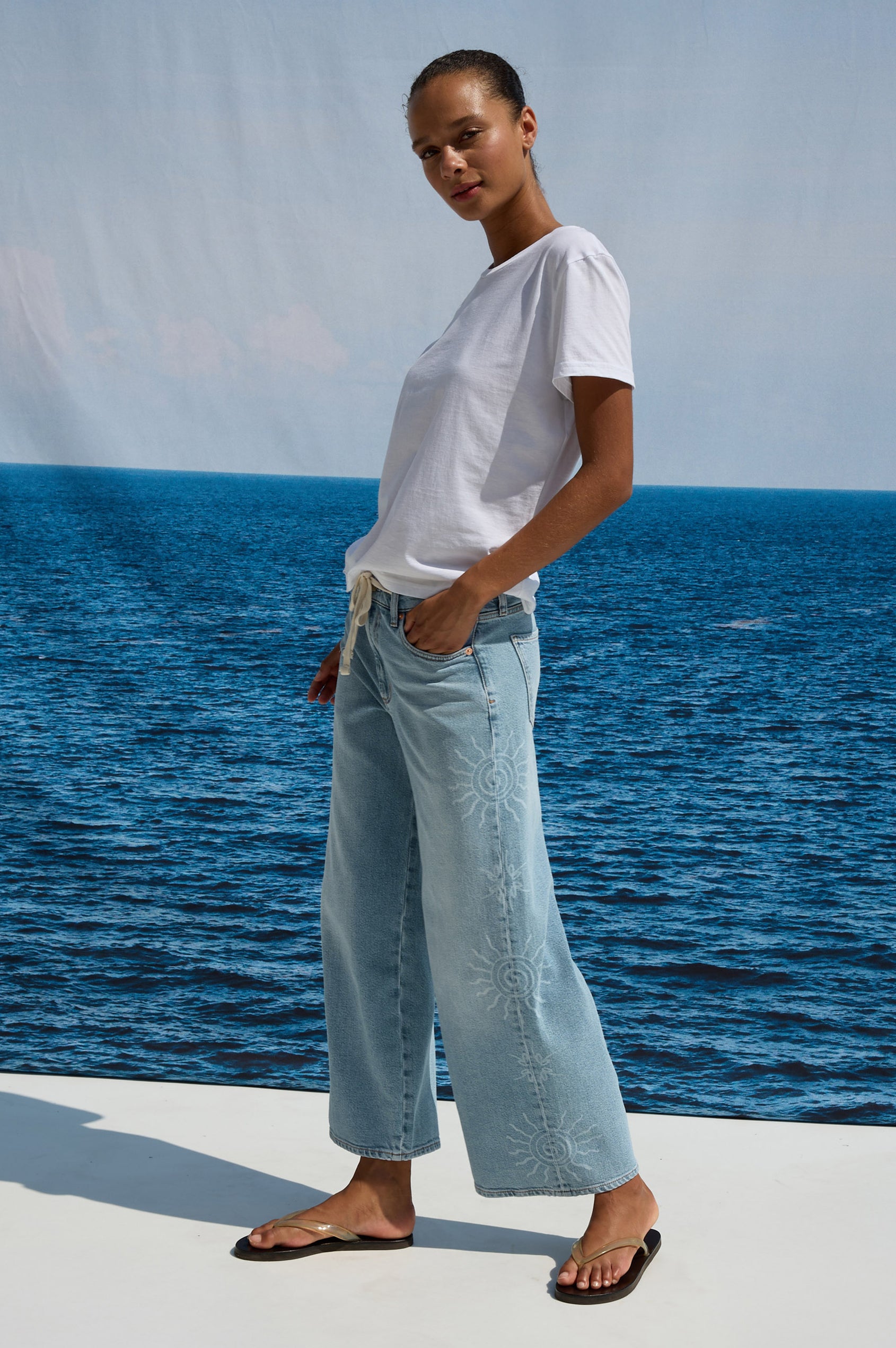Angeleno Crop Wide Leg Jean in Rigid Denim With Slight Stretch, Mid-Rise, Front Zip Fly, and 5-Pockets in Soleil Laser Colorway - Front VIew Featured on Model