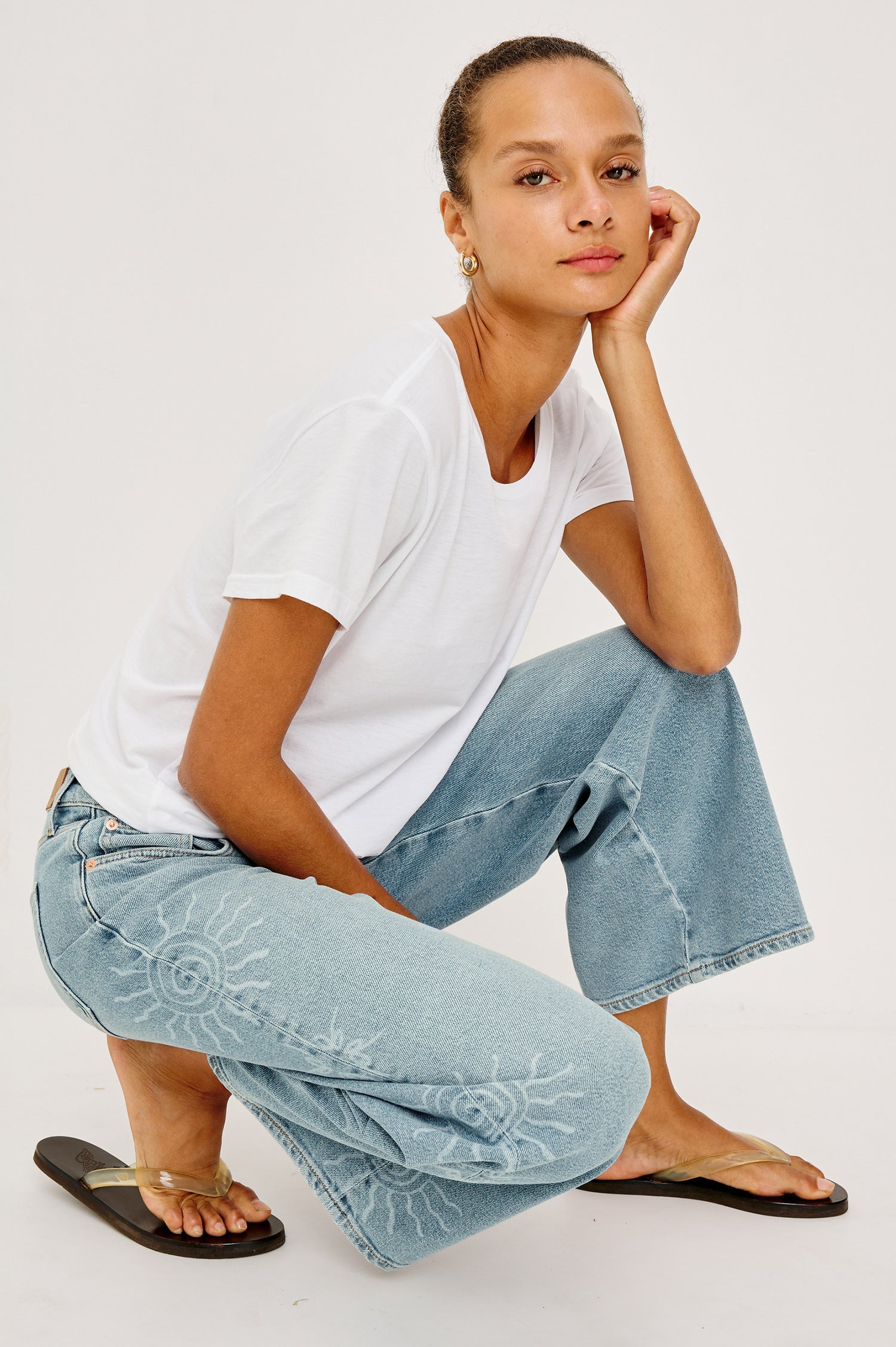 Angeleno Crop Wide Leg Jean in Rigid Denim With Slight Stretch, Mid-Rise, Front Zip Fly, and 5-Pockets in Soleil Laser Colorway - Full Body Back VIew Featured on Model