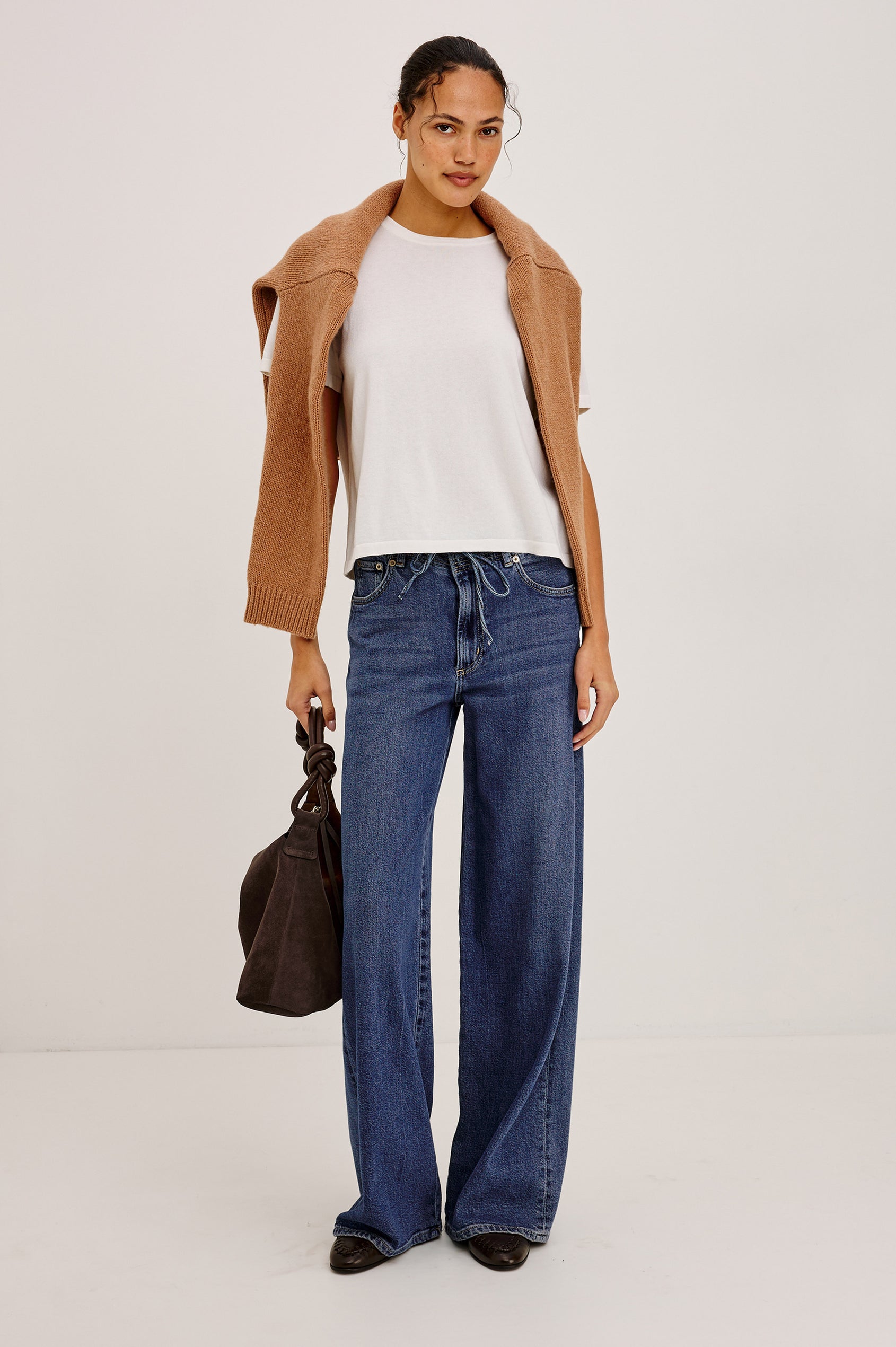 Angeleno Wide Leg in Rigid Denim With Hidden Stretch, Relaxed Mid-Rise Fit, 5-Pockets, Self-Tie Shoelace Belt, and Frayed Waistband in River Colorway - Full Body Front View Featured on Model