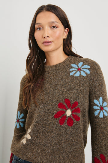Anise Long-Sleeve Sweater with a Crew Neck and Ribbed Trim in Winter Floral Colorway, with Blue, Cream and Red Flowers on Brown - Front View Featured on Model