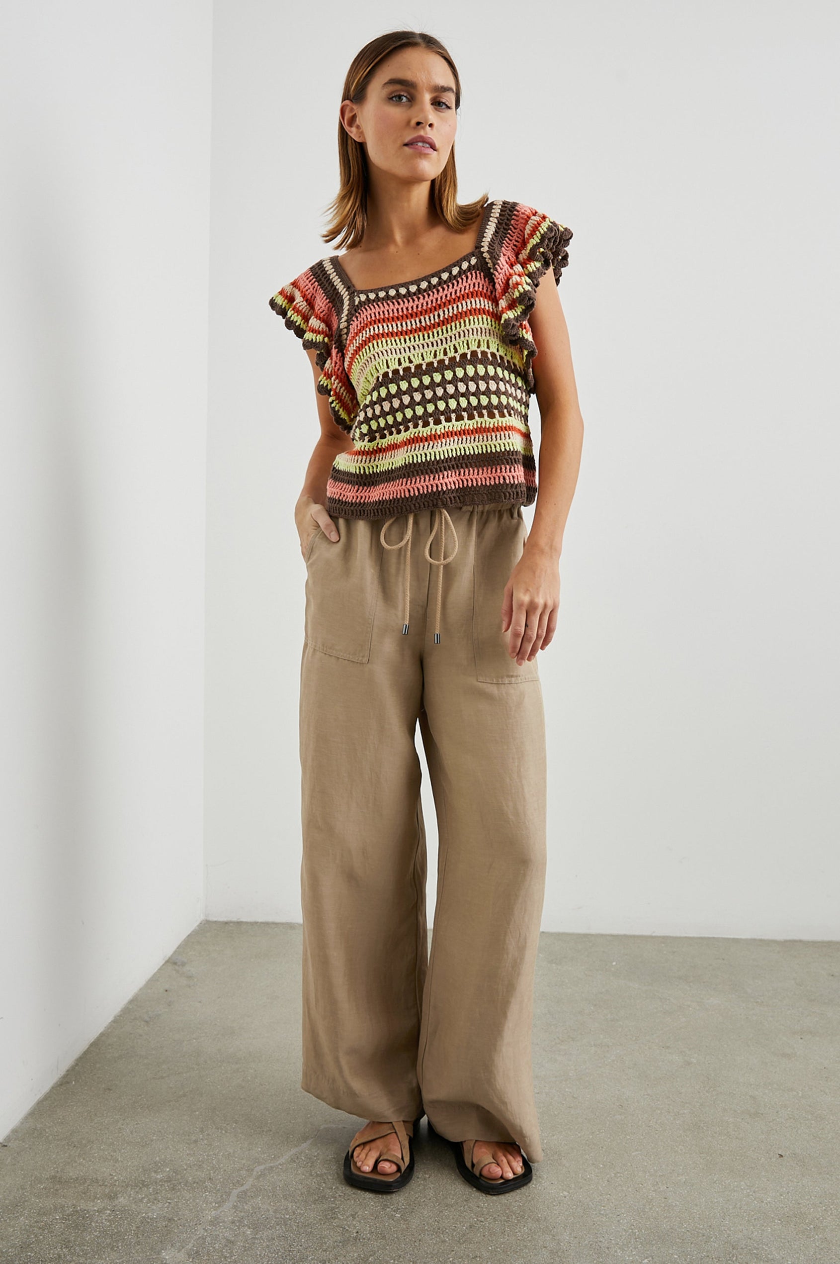 Anna Short Sleeve Crochet Top with Flared Sleeves and a Square Neck in Tropical Crochet Colorway, in Orange, Pink, Green, Brown, and White - Front Full Body View Featured on Model  