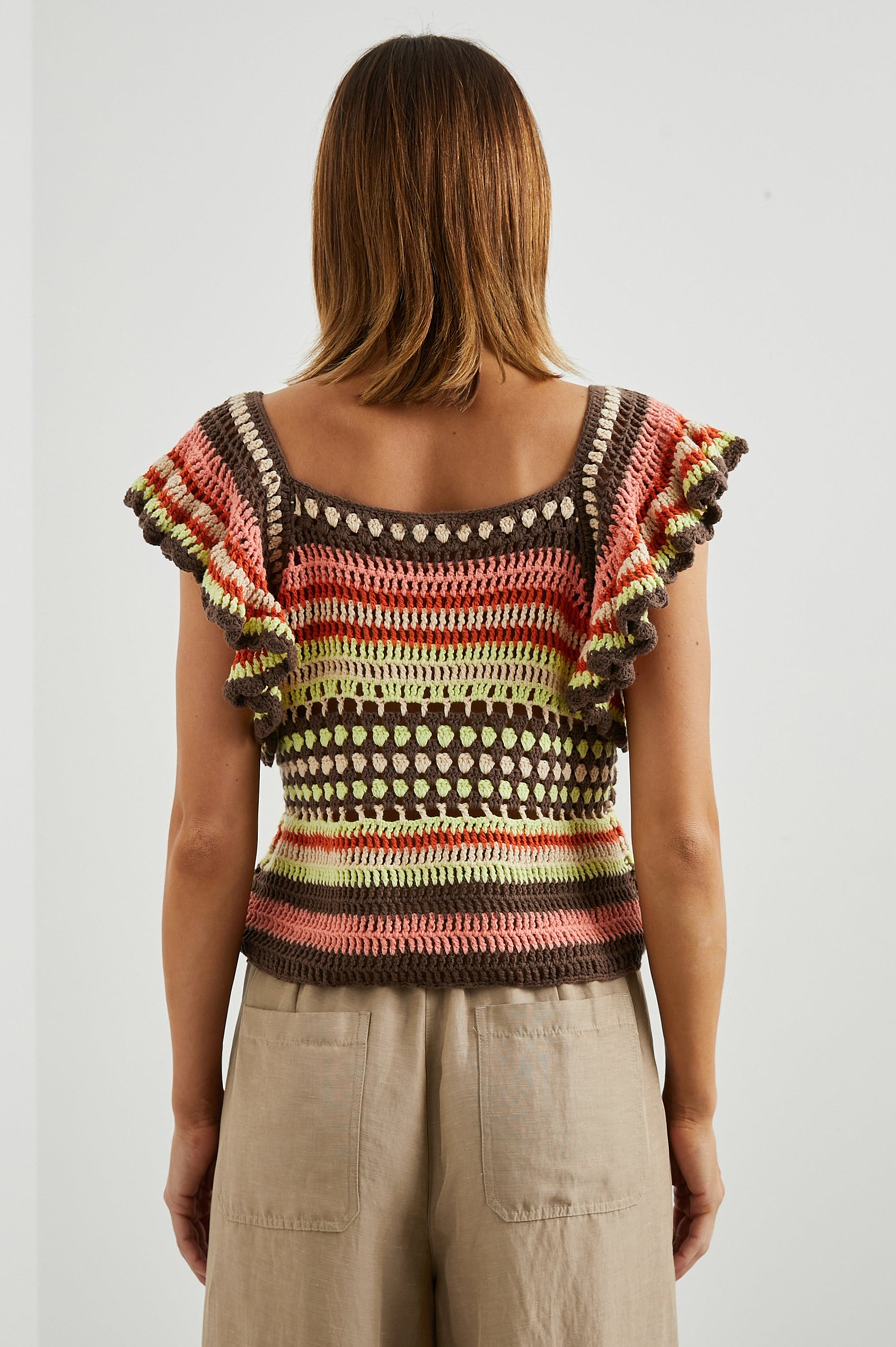 Anna Short Sleeve Crochet Top with Flared Sleeves and a Square Neck in Tropical Crochet Colorway, in Orange, Pink, Green, Brown, and White - Back View Featured on Model  