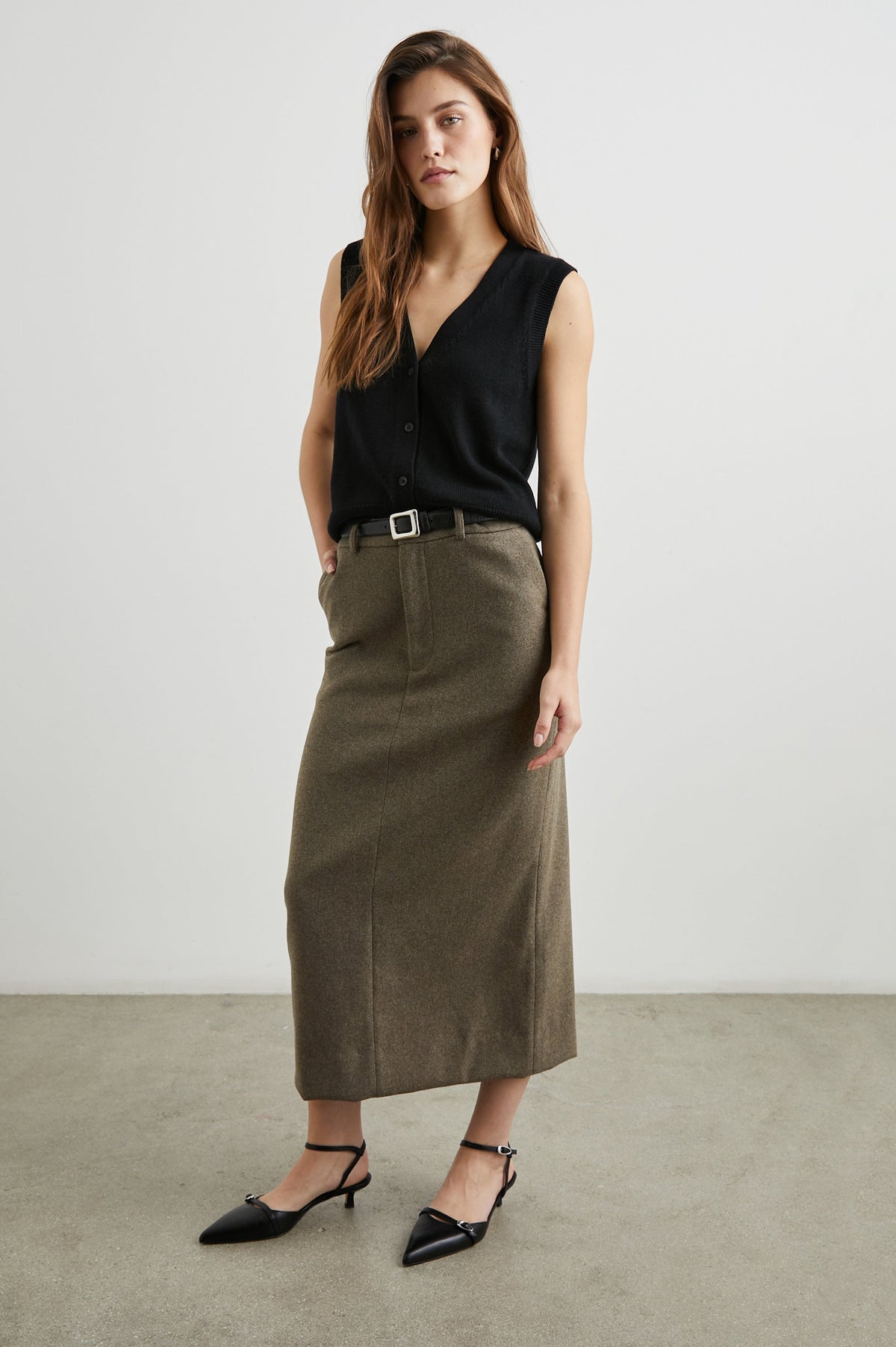 Annika Vest with a Deep V Neck and Button Closure in Jet Black Colorway - Front Full Body View Featured on Model 