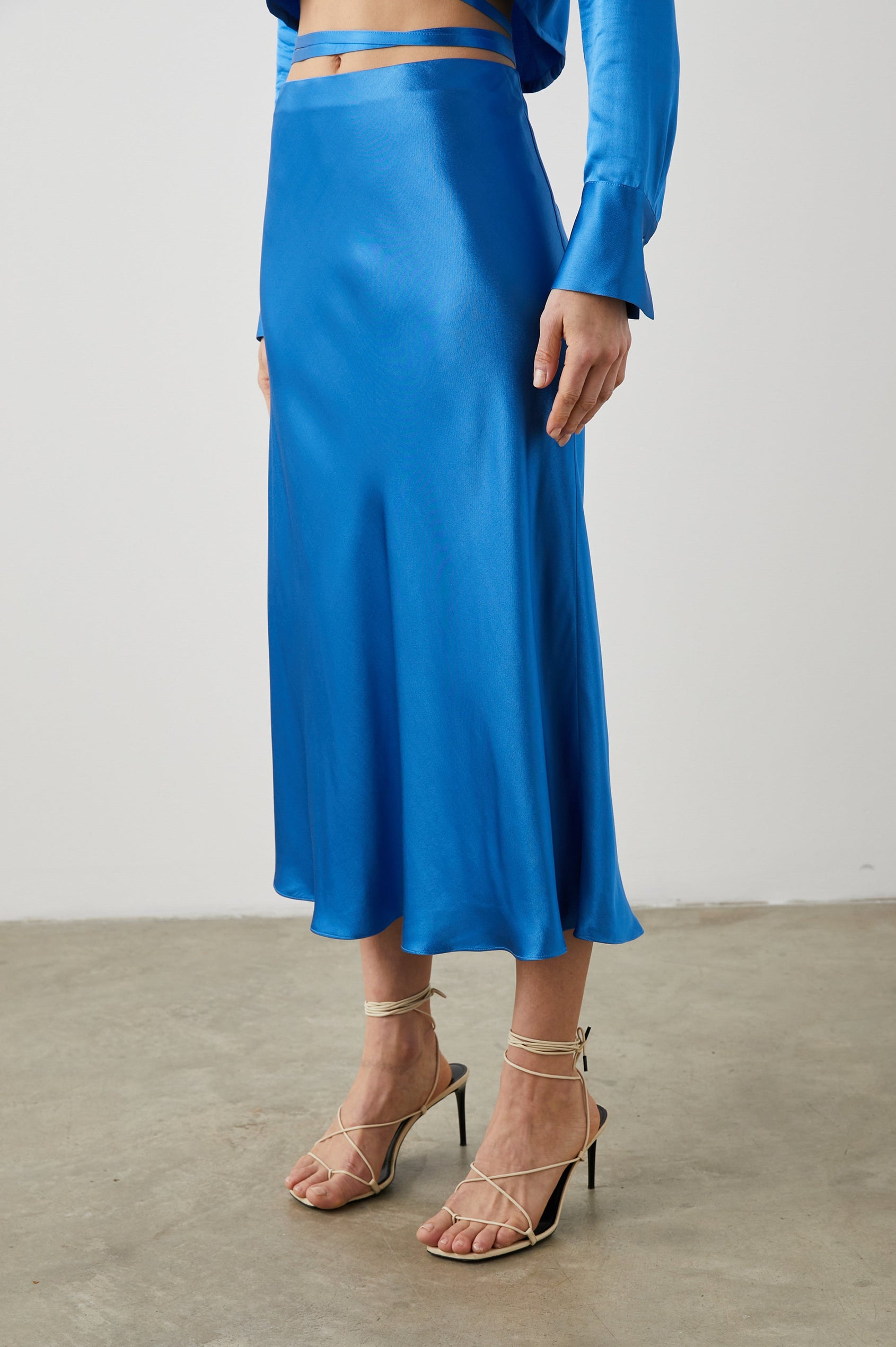Anya High-waisted Midi Skirt in Cobalt Colorway - Front View Featured on Model
