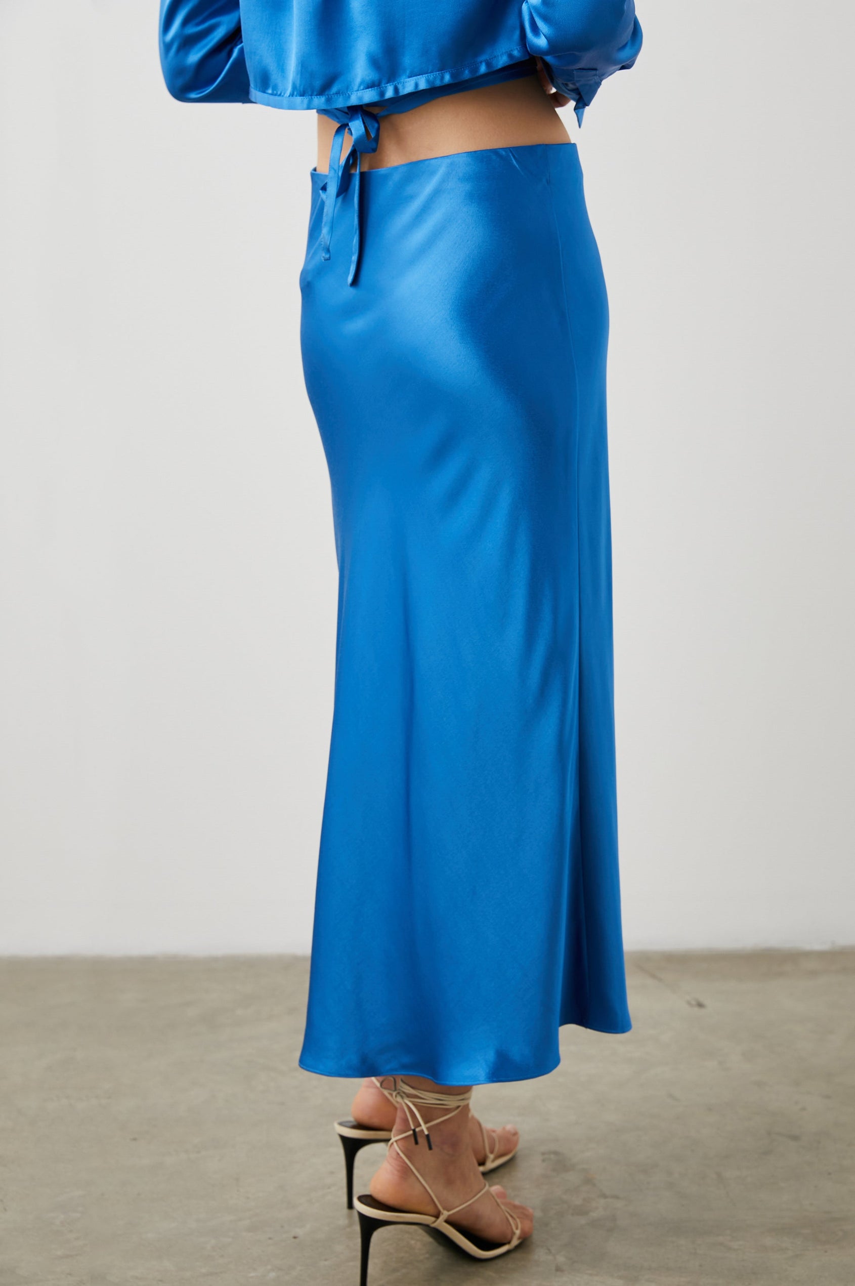 Anya High-waisted Midi Skirt in Cobalt Colorway - Back View Featured on Model