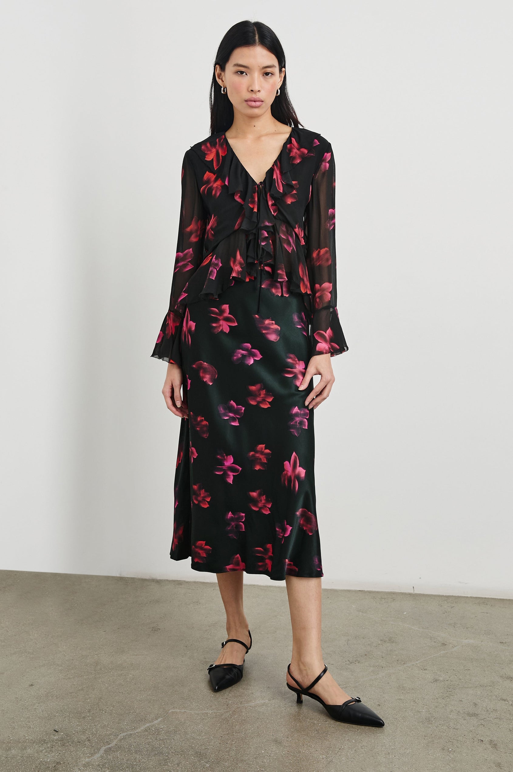 Anya High-waisted Midi Skirt in Dark Azalea Colorway, Flowers in pinks and purples on black - Front Full Body View Featured on model