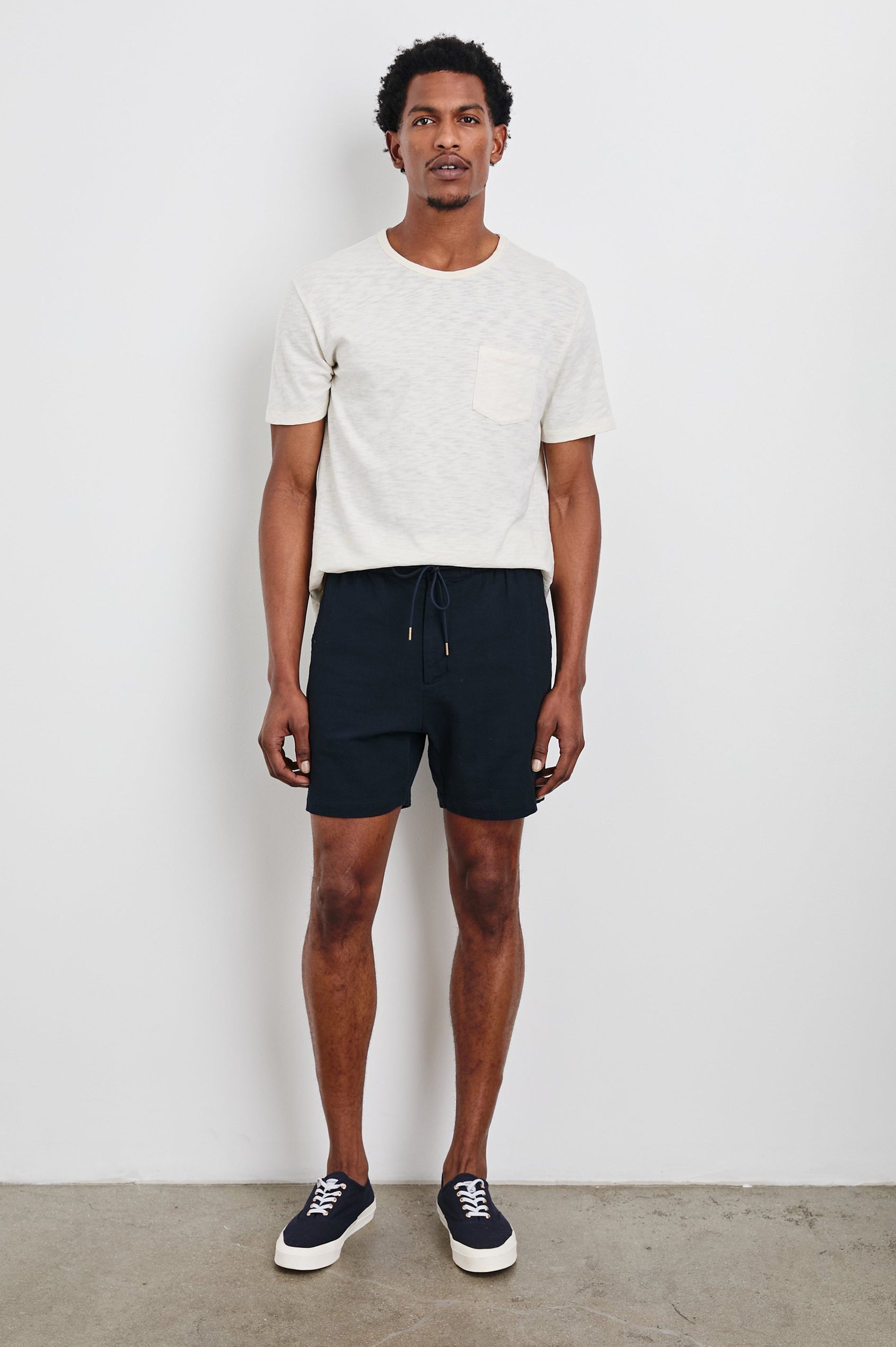 Archer 6" Shorts with a Drawstring Waist, Zipper Fly with Button, Two Front Pockets and a Back Patch Pocket in Deep Meridian Colorway - Front Full Body View Featured on Model