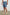 Archer long length cotton short with adjustable drawstring and front button closure in Washed Blue - front view on model, slight angle in motion.