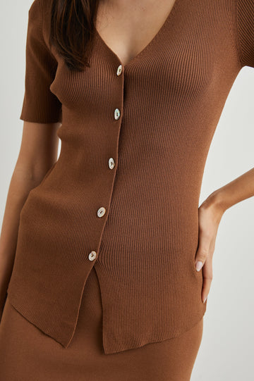 Arden Ribbed, Short Sleeve Top with a Deep V Neck and Buttons Down the Front in Cacao Colorway - Front View Featured on Model 