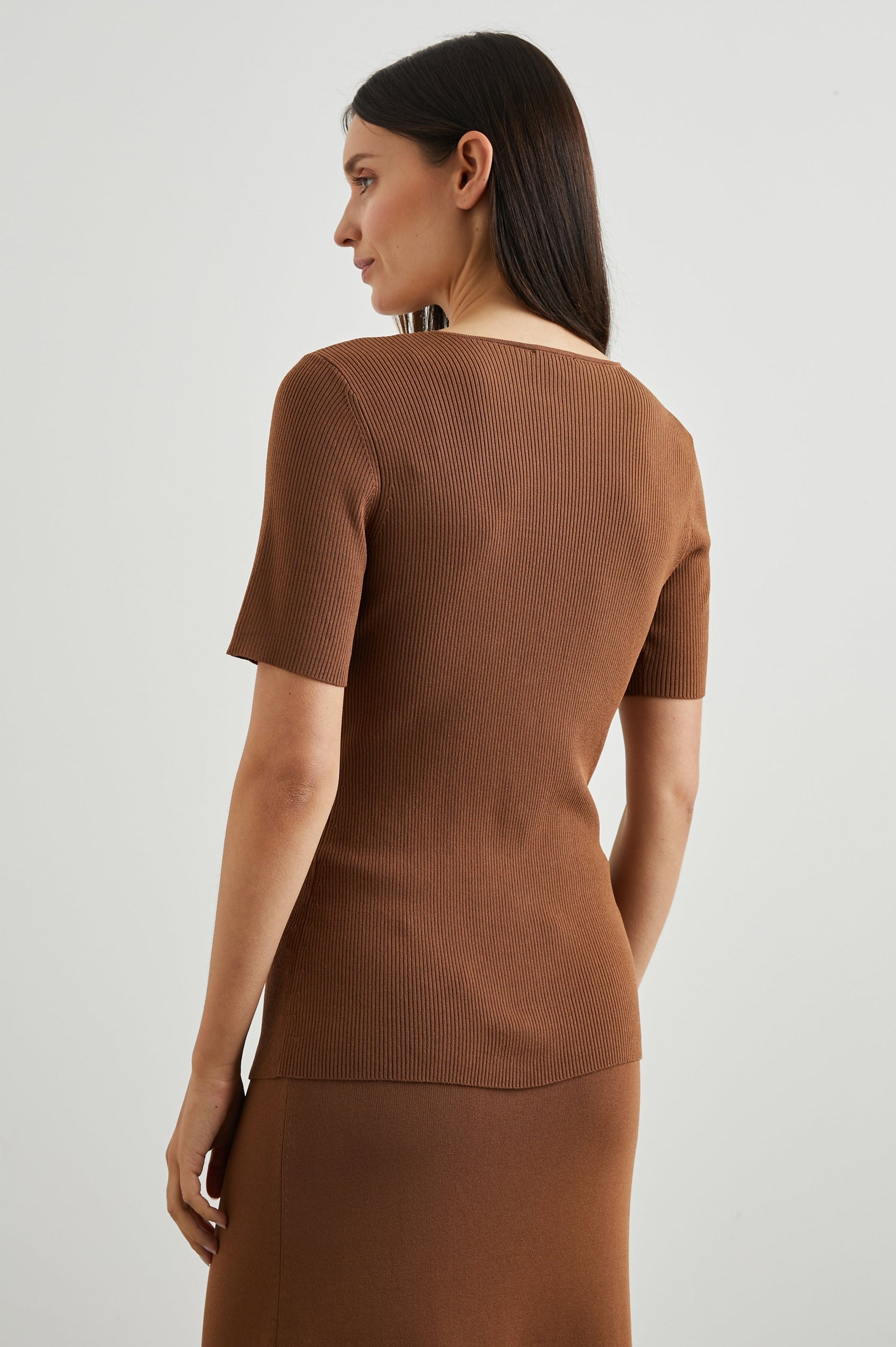 Arden Ribbed, Short Sleeve Top with a Deep V Neck and Buttons Down the Front in Cacao Colorway - Back View Featured on Model 