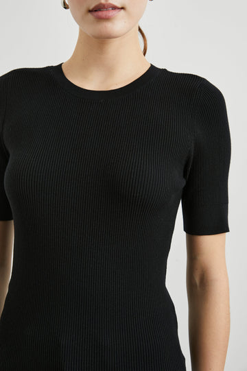 Ari Short-Sleeve Ribbed Top with a Crew Neck in Black Colorway - Front View Featured on Model