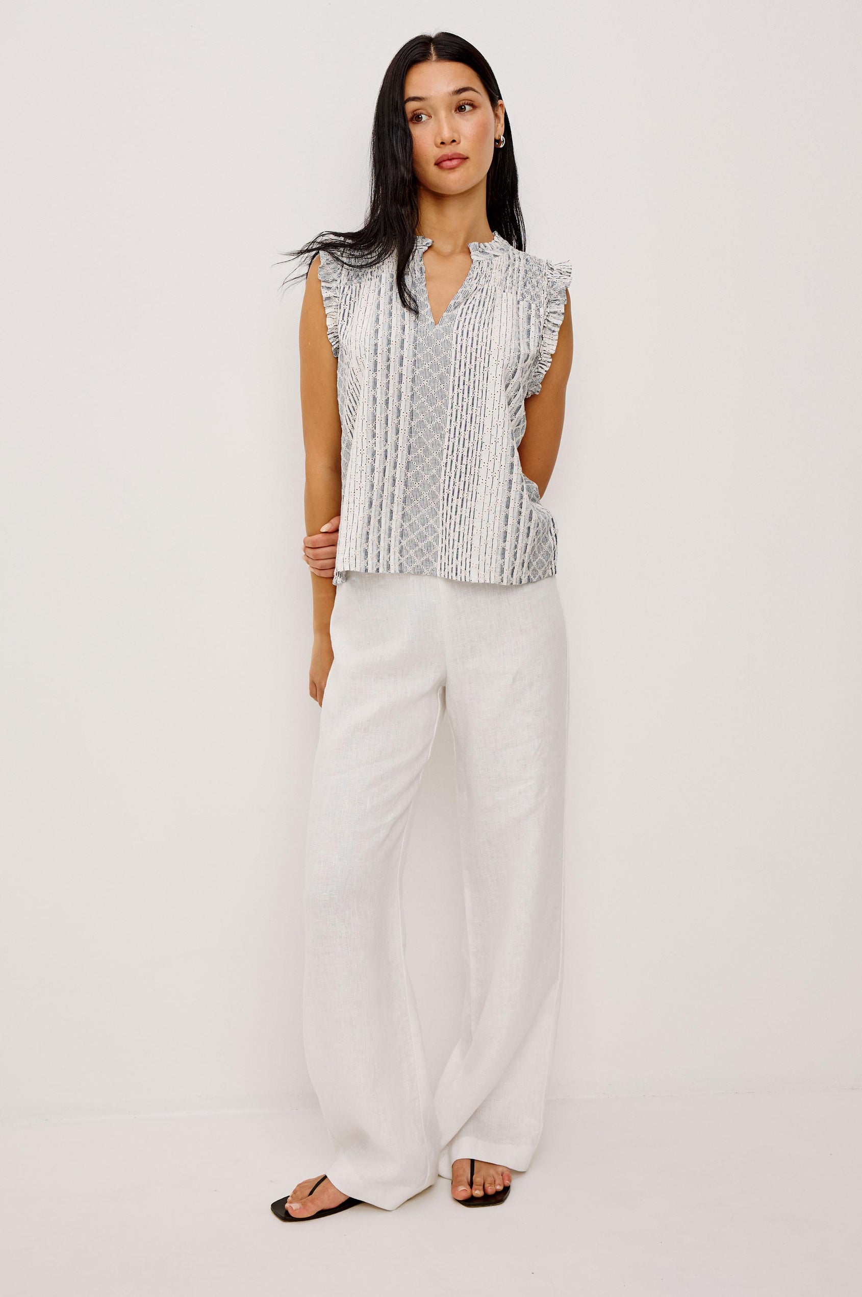 Arlene Sleeveless Top in Luxe Linen With V-Neckline, Pleated Collar, and Smocked Bodice in Striped Eyelet Colorway - Full Body Front View Featured on Model