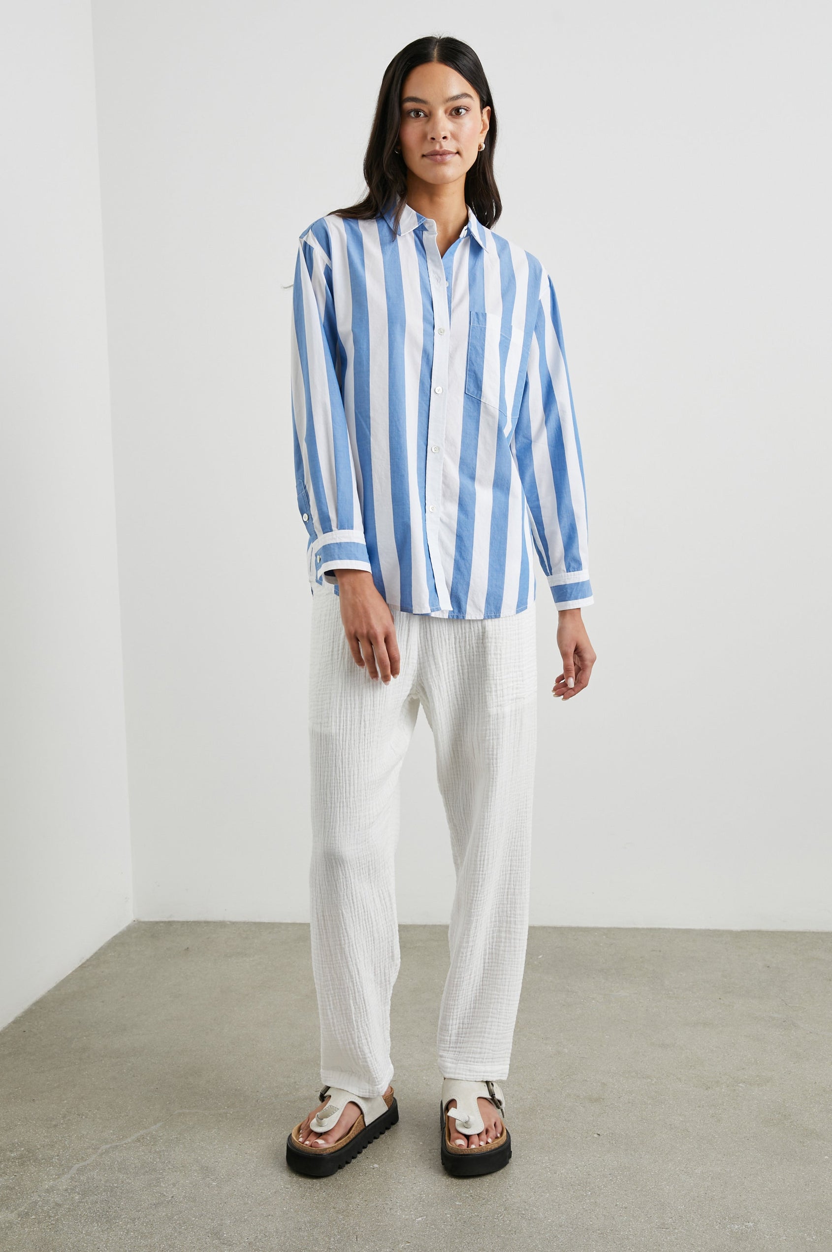 Arlo Long Sleeve Button Up with Chest Patch Pocket in Rue Stripe Colorway, vertical blue and white stripes - Front Full Body View Featured on Model