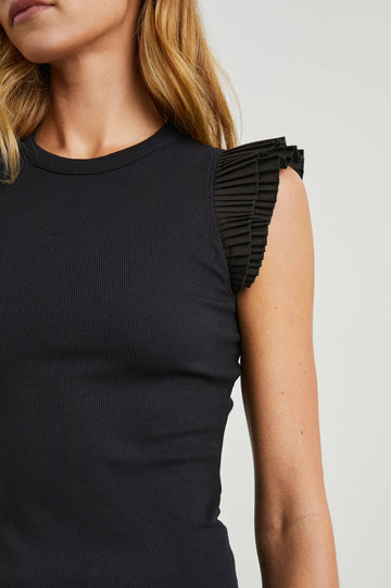 Asha Short-Sleeve Ribbed Top with a Crew Neck and Pleated Flutter Sleeves in Black Colorway - Front View Featured on Model