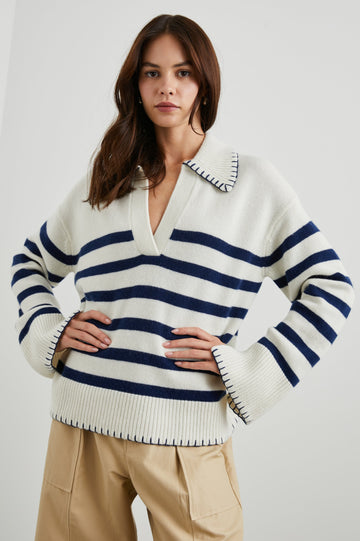 Athena Long-Sleeve Sweater with a Flat Collar V Neckline, Ribbed Cuffs and Hem and Contrast Stitching at the Cuffs and Hem in Ivory Navy Stripe Colorway, Horizontal Stripes - Front View Featured on Model 