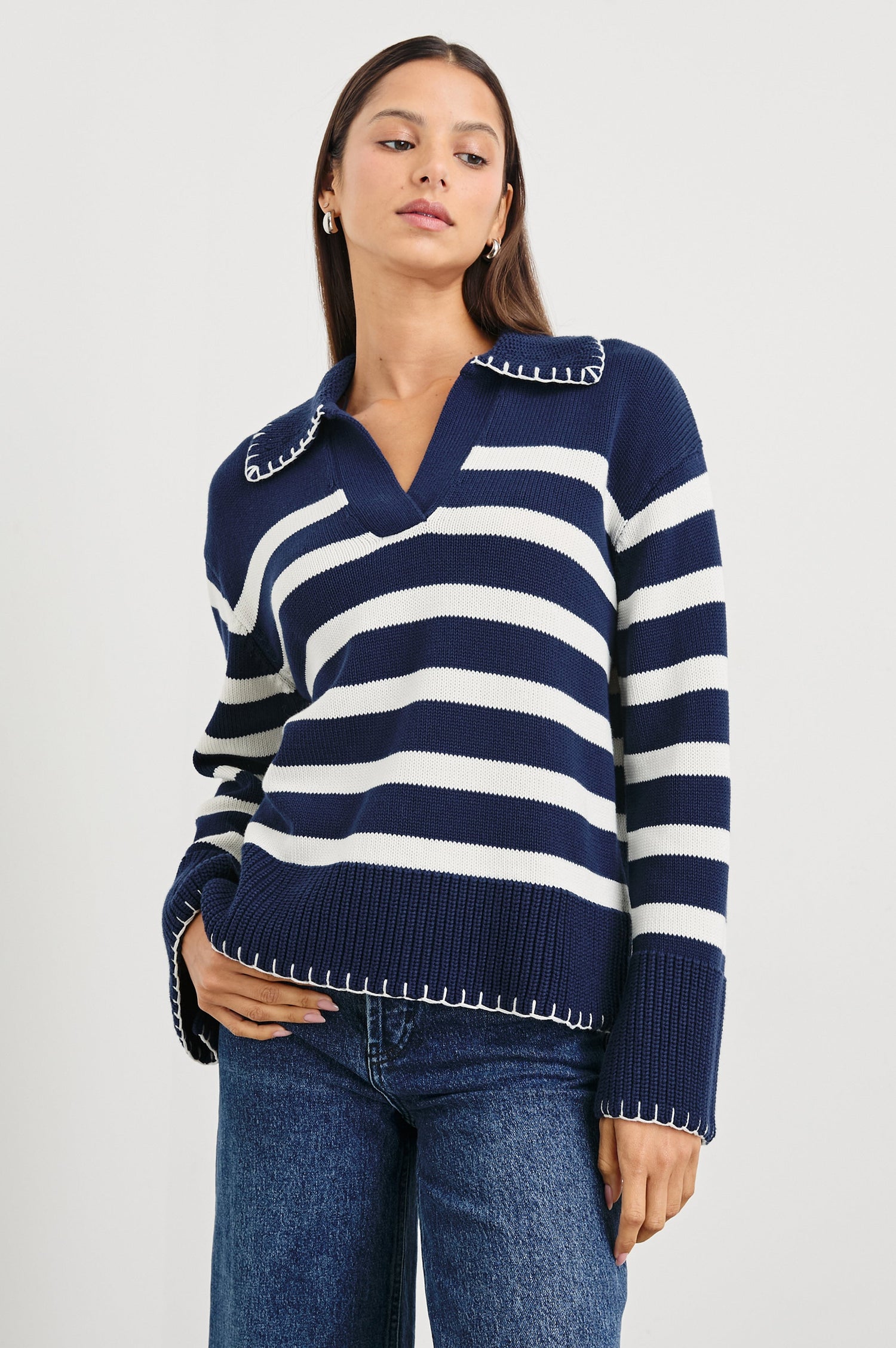Athena Long-Sleeve Sweater with a Flat Collar V Neckline, Ribbed Cuffs and Hem and Contrast Stitching at the Cuffs and Hem in Navy Ivory Stripe Colorway, Horizontal Stripes - Front View Featured on Model 