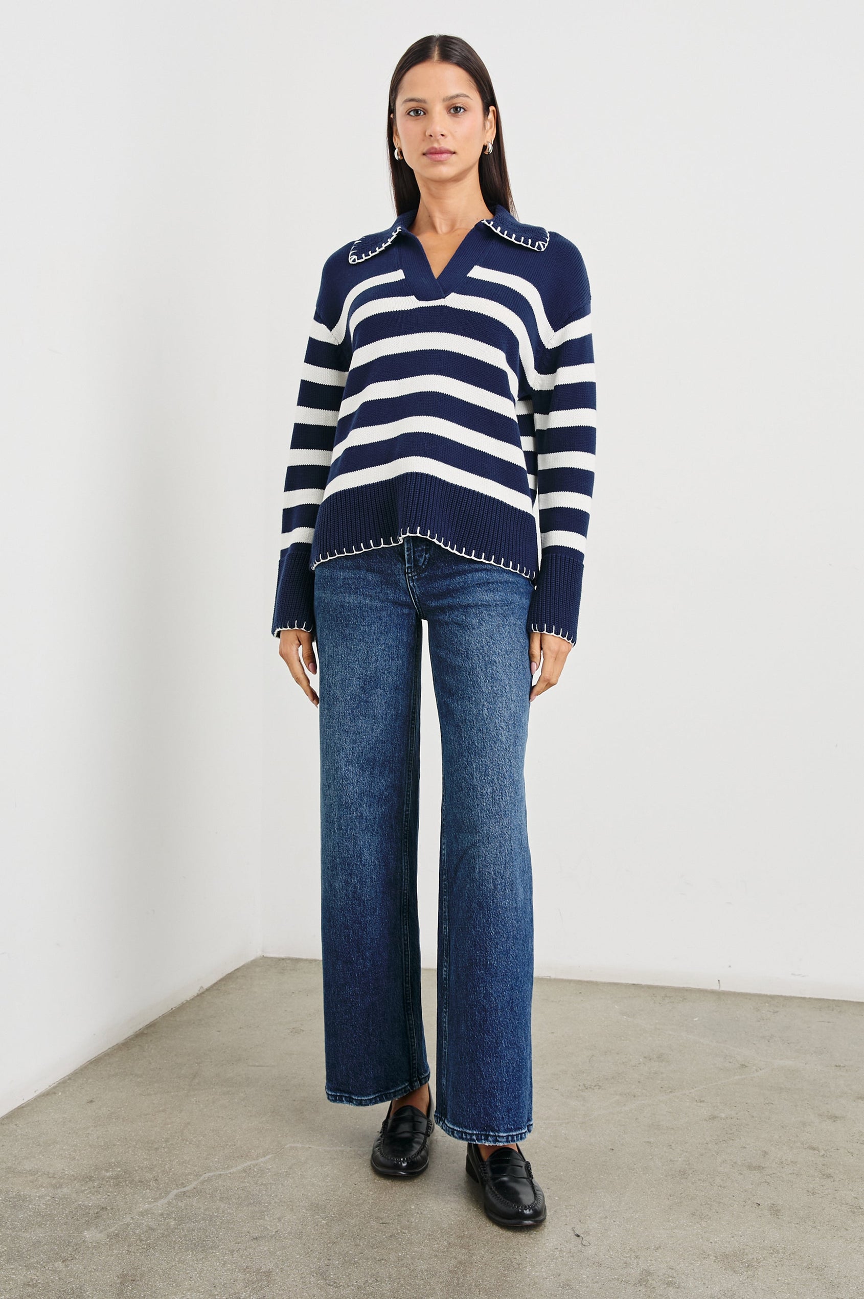 Athena Long-Sleeve Sweater with a Flat Collar V Neckline, Ribbed Cuffs and Hem and Contrast Stitching at the Cuffs and Hem in Navy Ivory Stripe Colorway, Horizontal Stripes - Front Full Body View Featured on Model 
