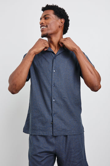 Atlas Short-Sleeve Button Up in Navy Cedar Vertical Colorway, with Thin Vertical Cedar Dashes on Navy - Front View Featured on Model