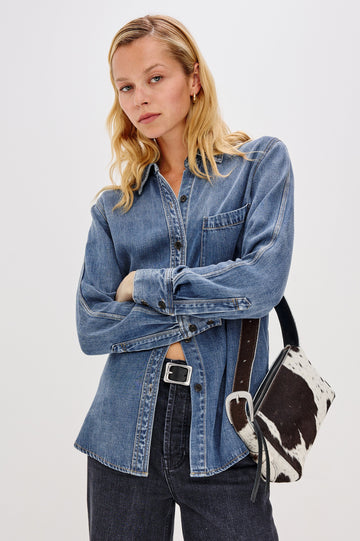 Atticus Long-Sleeve Denim Style Button Up with Chest Patch Pocket in Antique Blue Colorway - Front View Featured on Model Styled with Cowhide Purse