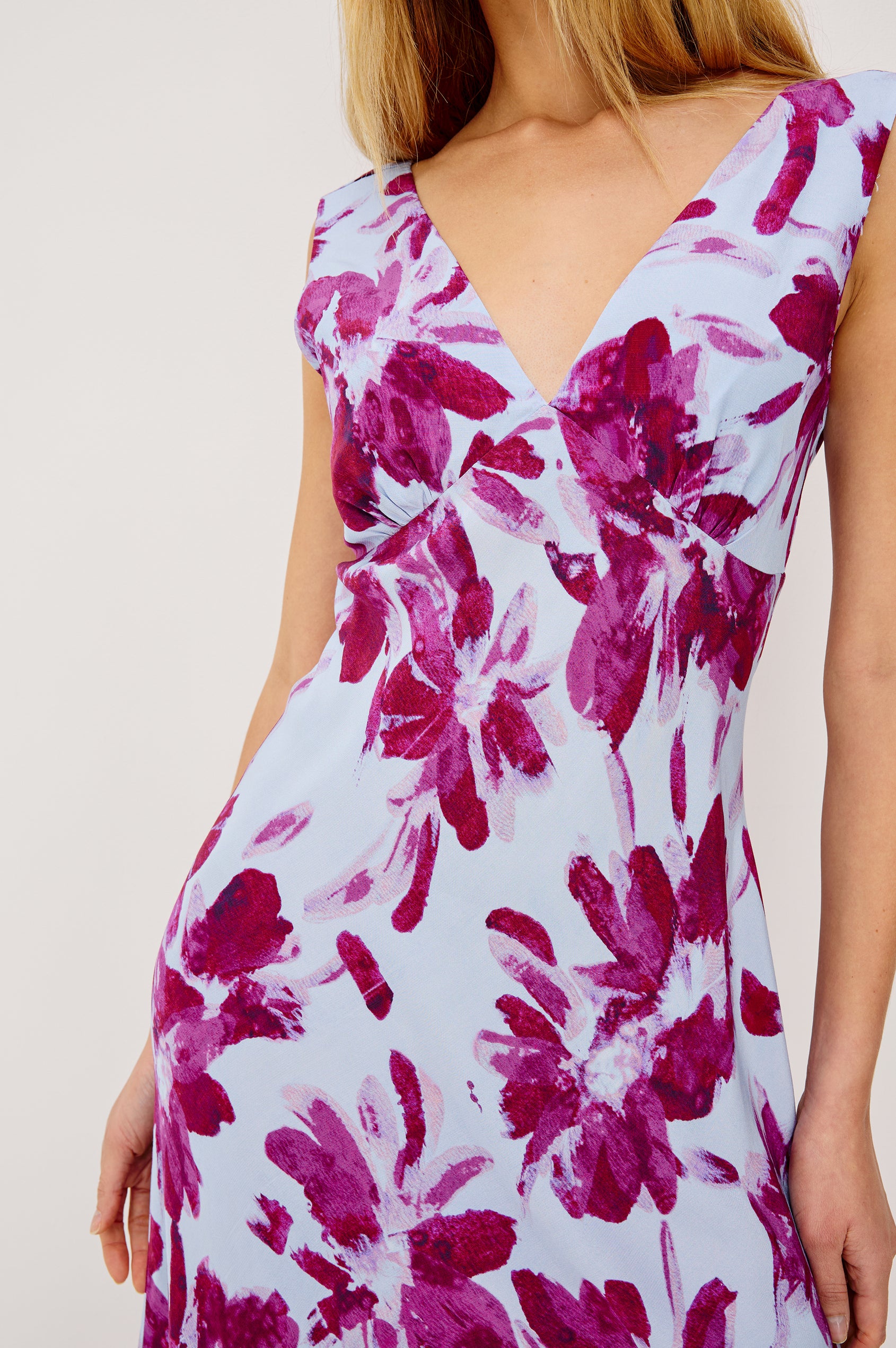 Audrina Sleeveless Midi Dress with Wide Shoulder Straps, a Deep V Neck and V-Back, and an Empire Waist in Blue Lily Colorway - front view on model